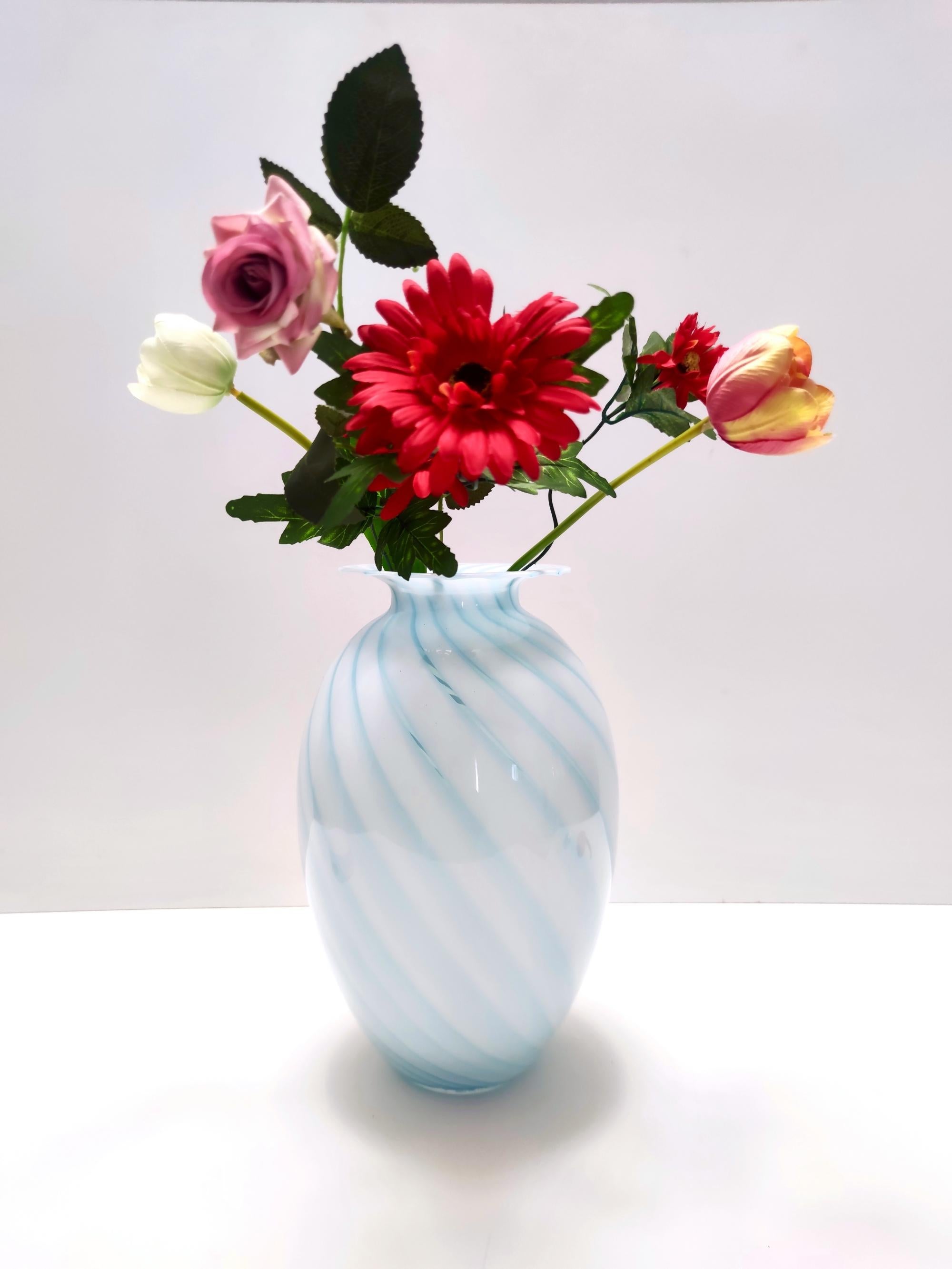 Made in Italy, 1970s.
This vase is made in Murano glass and features light blue and white canes.
This decanter is a vintage item, therefore it might show slight traces of use, but it can be considered as in excellent original condition and ready to