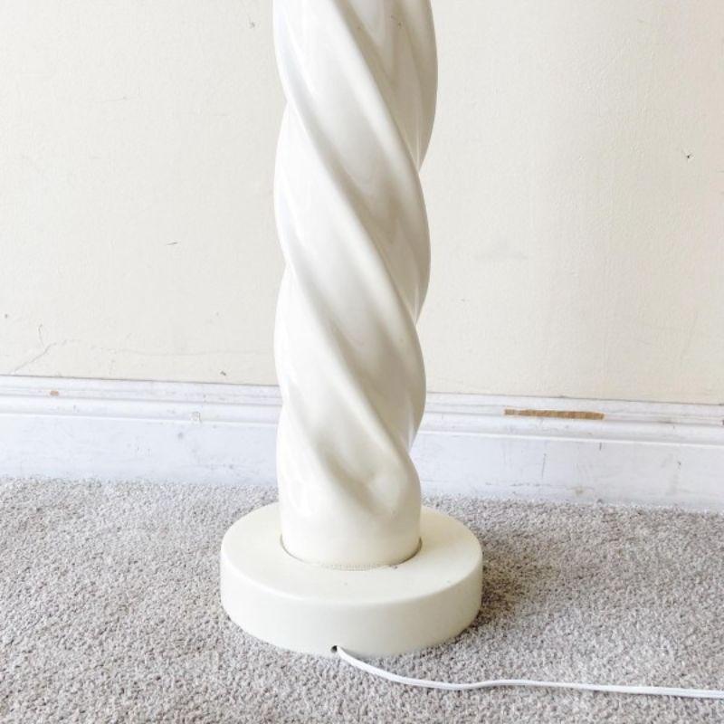 Incredible postmodern ceramic floor lamp. Feature an off white sculpted swirl body.

Additional information:
Materials: Ceramic
Color: White
Style: Postmodern
Time Period: 1980s
Place of Origin: USA
Dimensions: 9.5