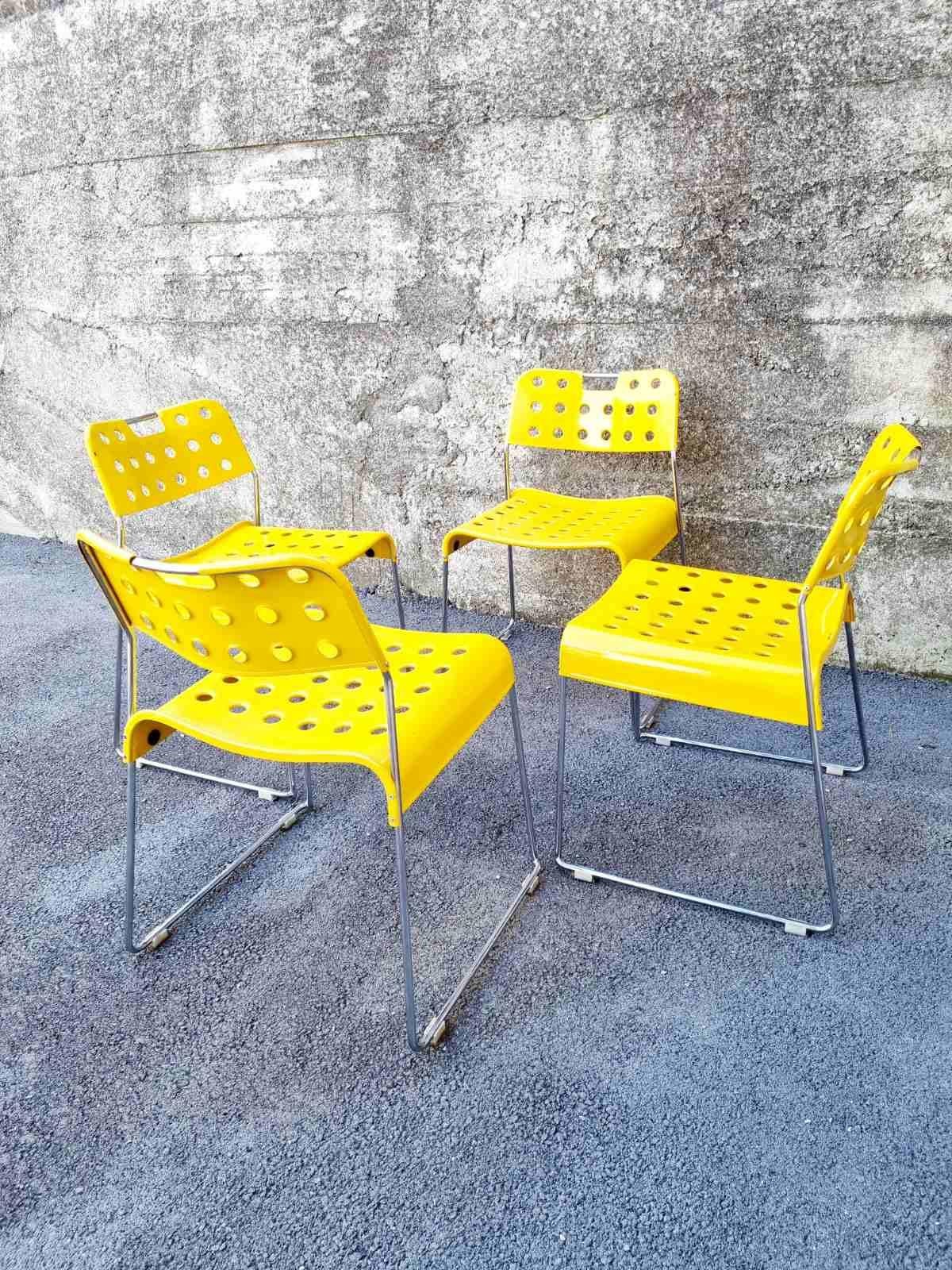 Set of 4 metal dining chairs model Omkstak designed by Rodney Kinsman and produced by Bieffeplast Padova in the 70s.
Tubular steel chromed frame, seat and back rest of moulded sheet steel coated with yellow epoxy resin. The perforated details make