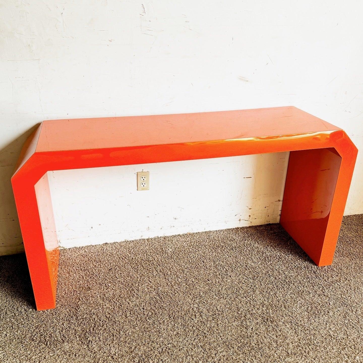 Discover the Postmodern Orange Lacquer Console Table, featuring a geometric design and vibrant finish, perfect for contemporary spaces.
 
 We sell items as acquired, without restoring or repairing. Vintage pieces may have age-related wear. Review