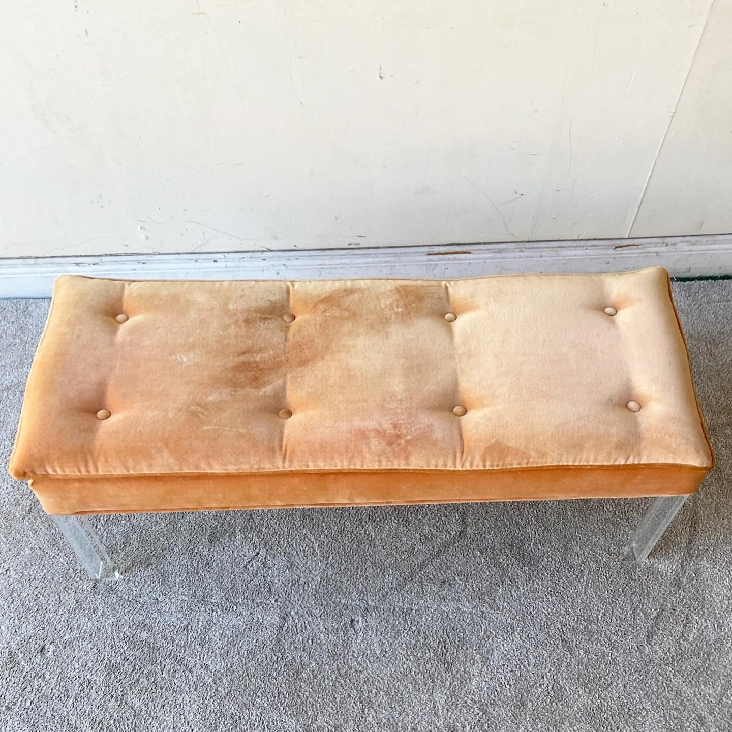 Exceptional vintage Postmodern bench with lucite legs. Features a fabulous fuzzy orange tufted seat cushion.
 
