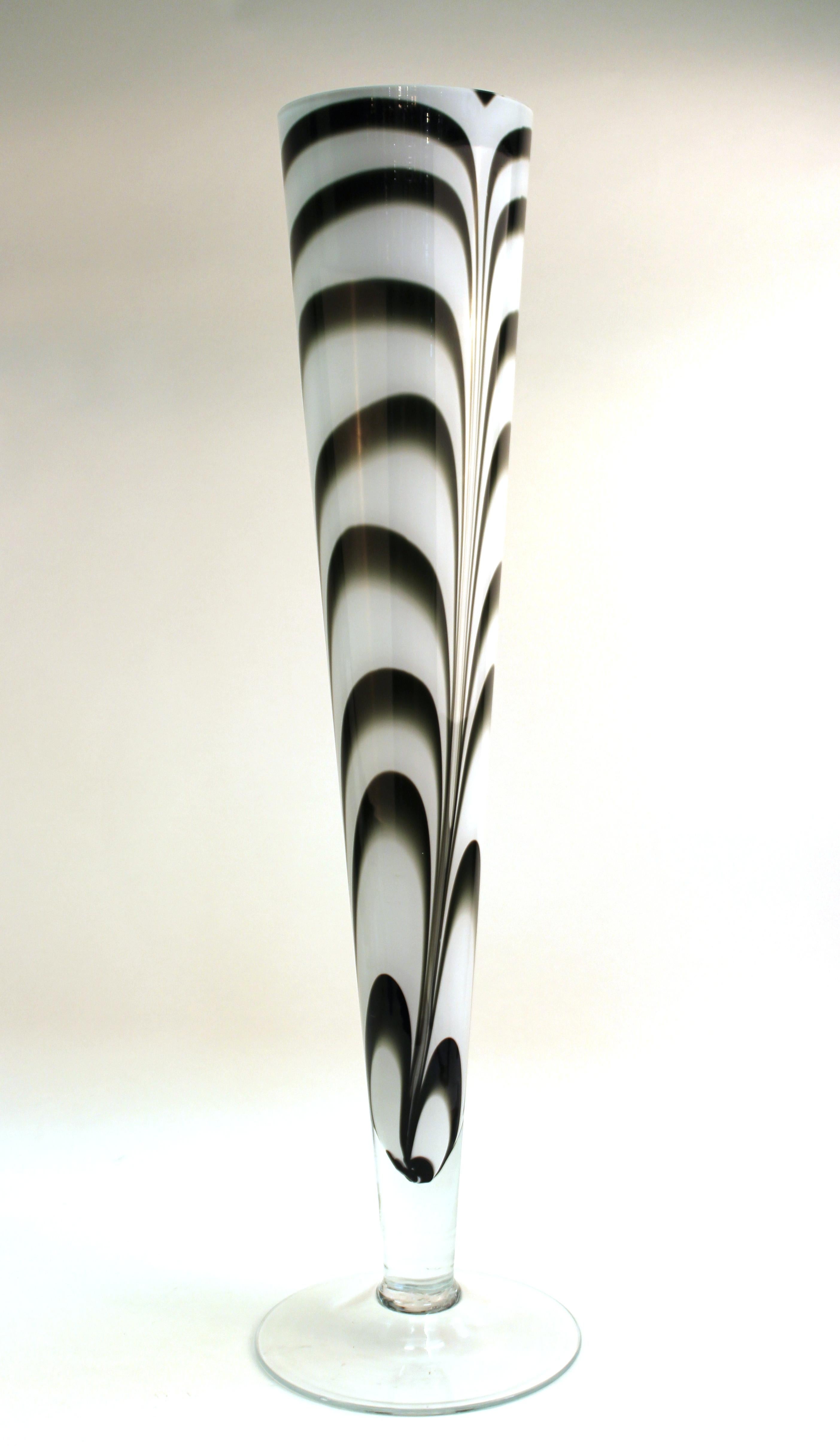 Postmodern oversized tubular shaped art glass vase designed in white feathered glass encased in clear glass. The piece can be used as a monumental tabletop vase. In great vintage condition with age-appropriate wear and use.