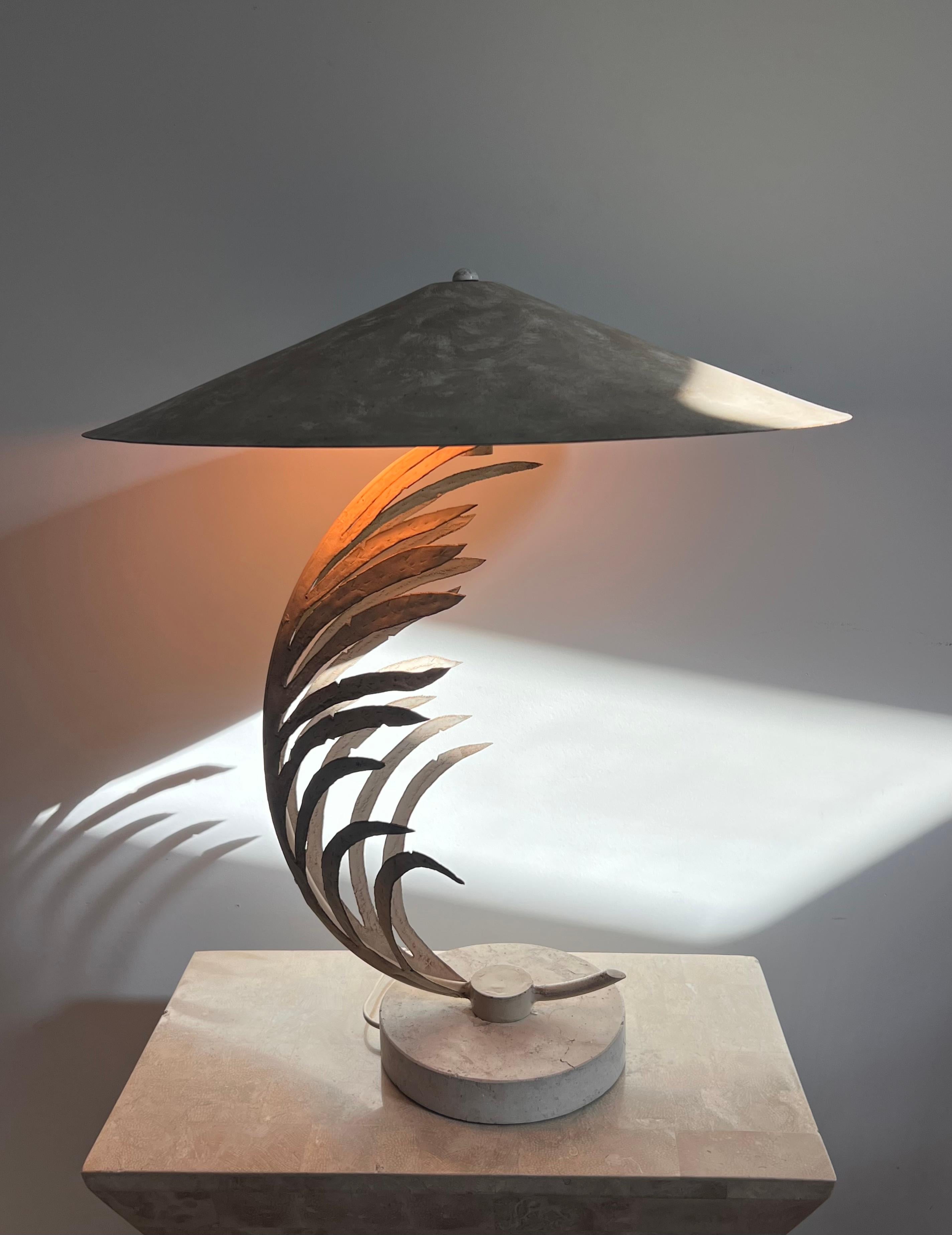 A vintage “frond” sculptural lamp designed by Michael Taylor, early 90s. Featuring a travertine base as well as a metal frame whose shape is very YSL Rive Gauche circa 1985. Scant signs of age as shown in photos but overall great condition.