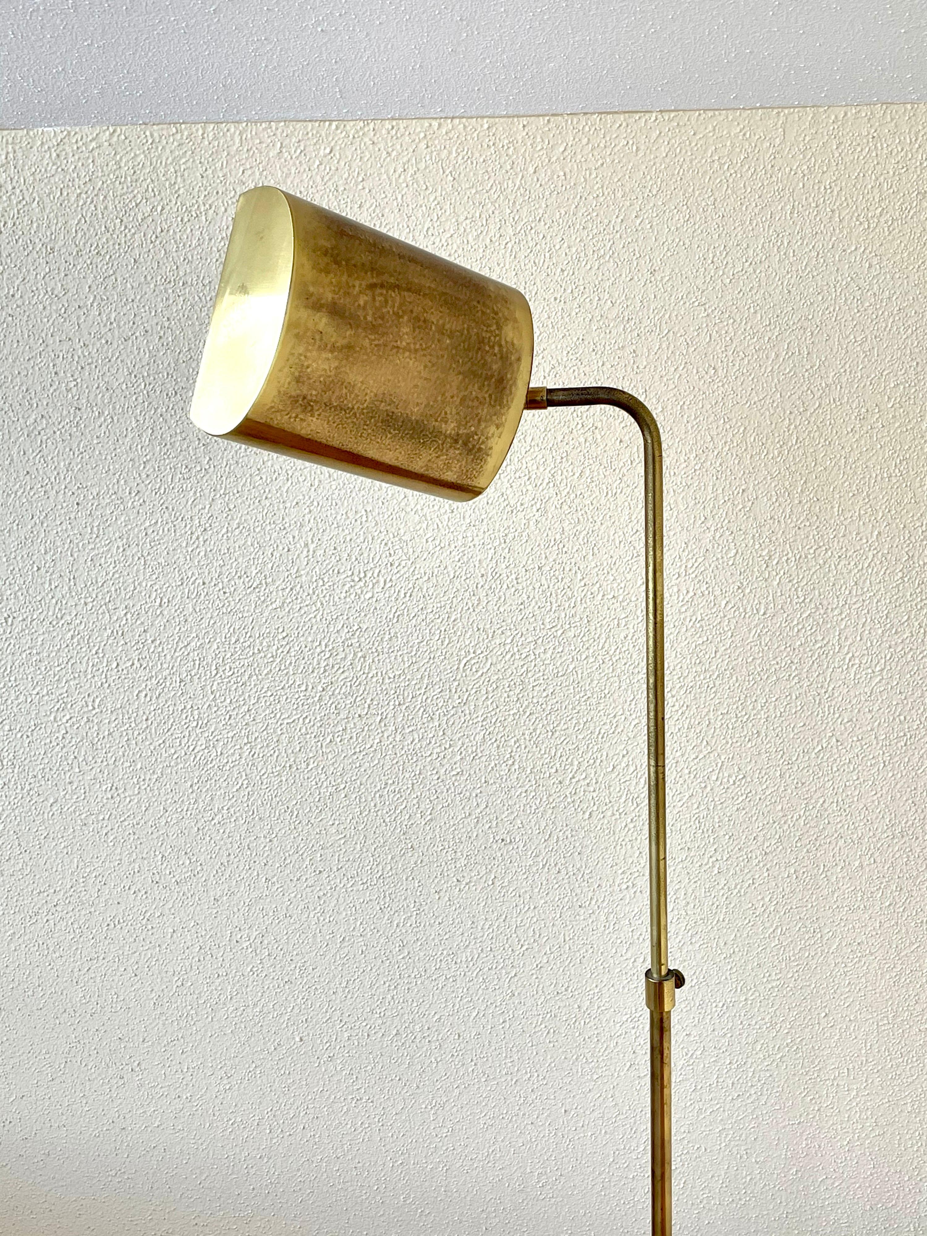 Great design circa 1980s with that Memphis look, in patinated brass finish, that can be polished if desired, the lamp goes up and down rotates to 360 degrees, and the shade moves up and down. with adjustable size.