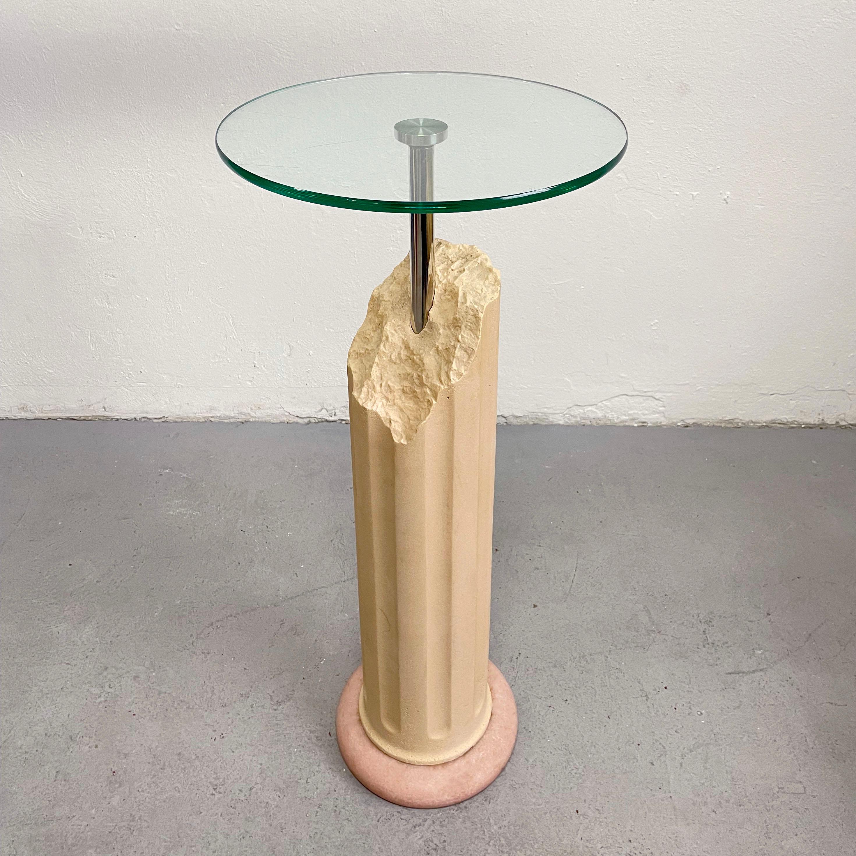 Postmodern pedestal table from the 1980s/1990s

Unknown manufacturer

The base is made of pink marble stone and concrete, table top is made of tempered clear glass

