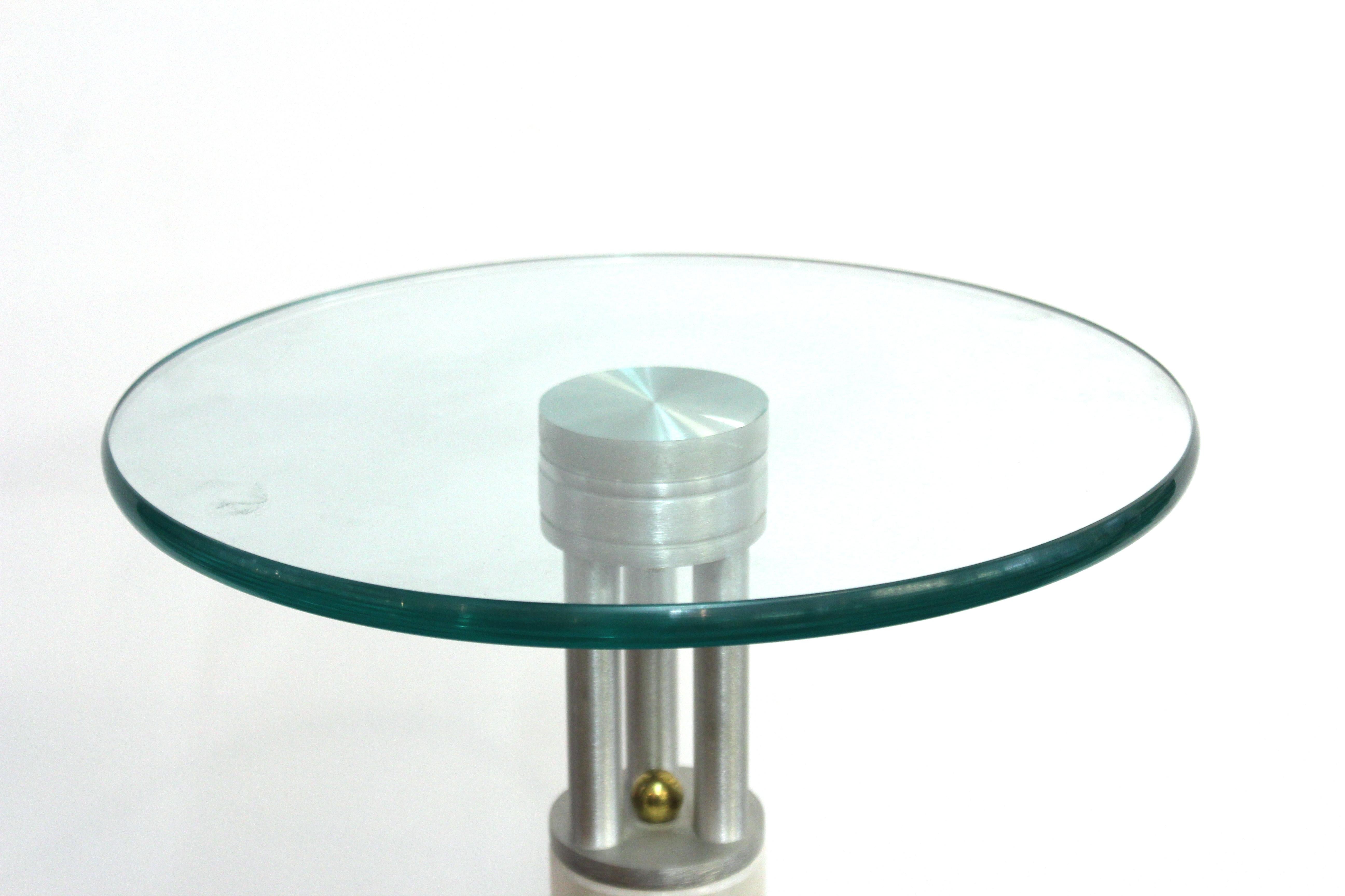 Postmodern pedestal or side table with a structure made of various metal and marble elements and a circular glass top. The piece dates from the circa 1990s and is in great vintage condition.