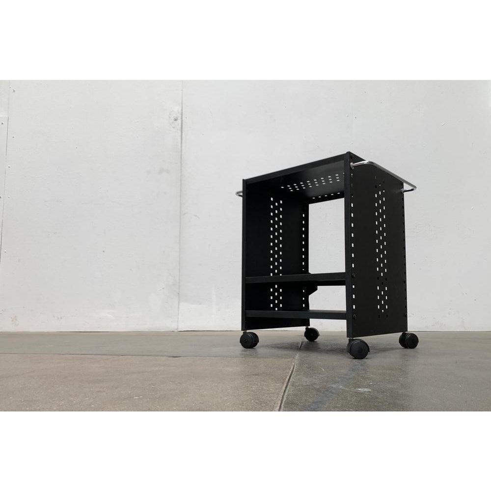 Postmodern Perforated Metal Serving Bar Trolley, 1980s, in Very Good conditions. Designed 1980 to 1989.

Additional information:
Materials: Metal
Styles: Memphis, Postmodern
Color: Black
Item Type: Vintage, Antique or Pre-owned
Dimensions: 22.05ʺW ×