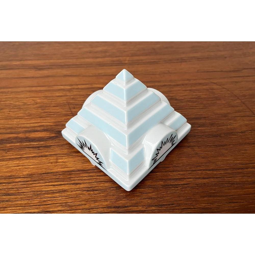 Pyramids, pointed lid for the Limited Edition Philip Morris ashtray from Rosenthal.

This top was designed by Frank Stella. The other stacking ashtrays from various designers. A new came out every year. All ashtrays can be stacked into a decorative