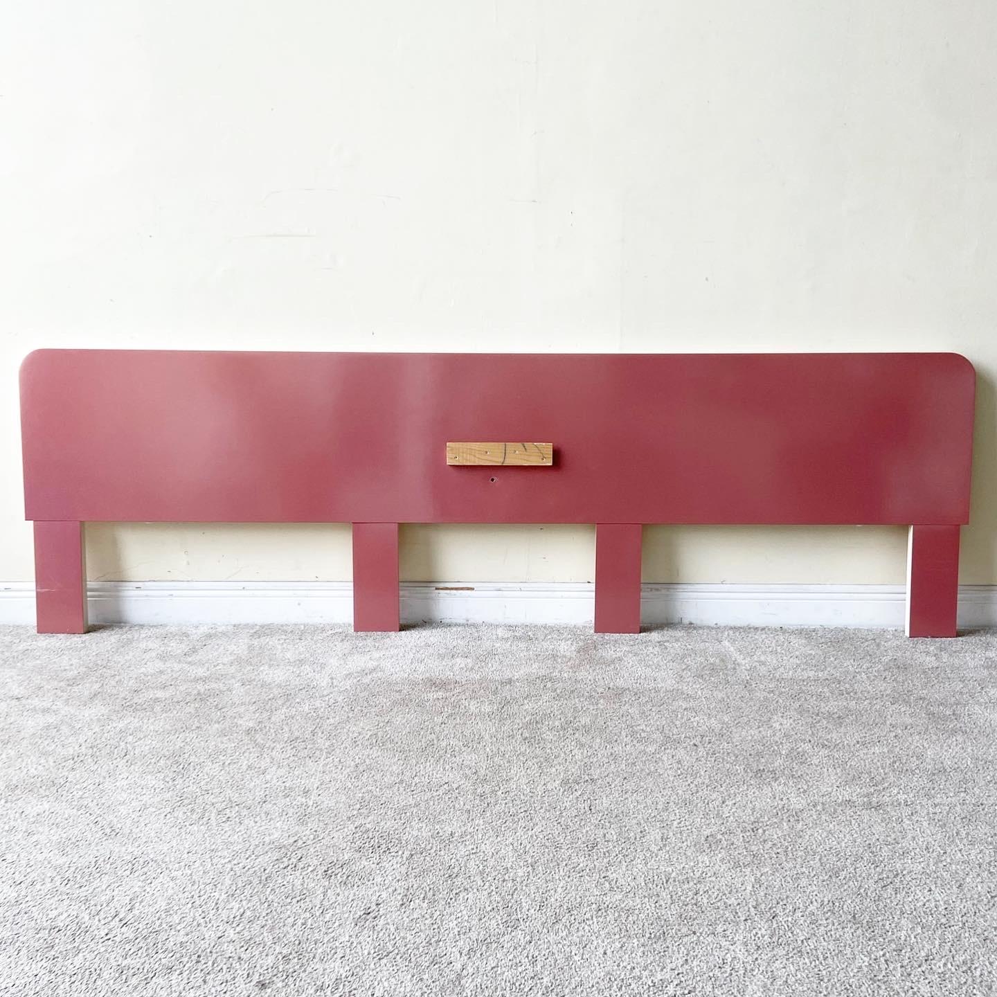 Incredible postmodern oversized headboard. Features a dark pink lacquer laminate and cream strip over the edges. A floating drawer was installed in the center and can be reinstalled in the same place or anywhere else on the face of the headboard.