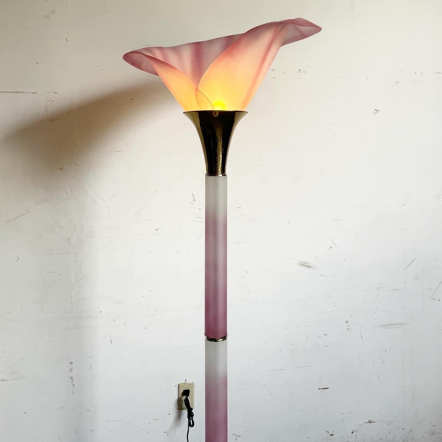 Add a splash of floral elegance with this Postmodern Pink and Gold Calla Lily Floor Lamp. Featuring a shade designed to mimic a Calla lily, this lamp brings a unique artistic touch to any space. The pink and gold accents provide modern