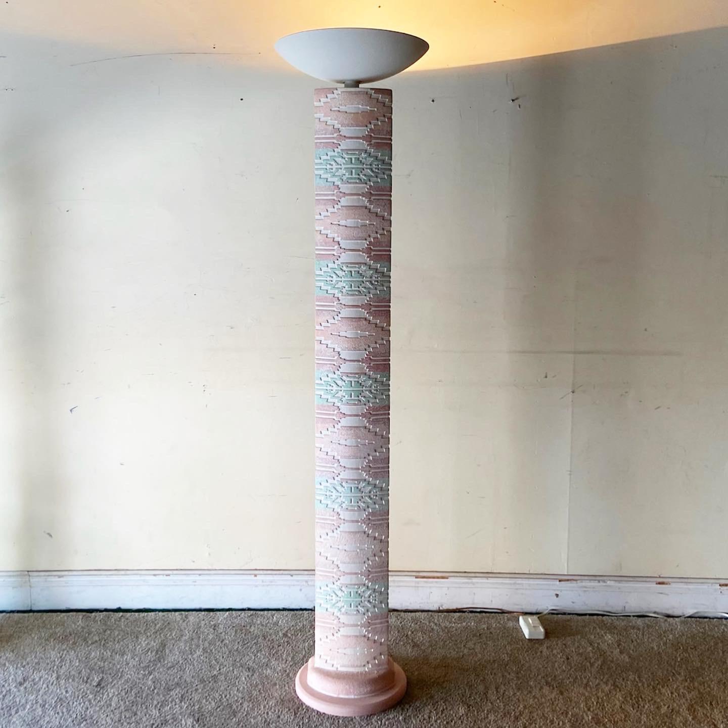 Exceptional postmodern southwest style plaster floor lamp. Features a sculpted totem pole design with a pink, white and green finish.
  