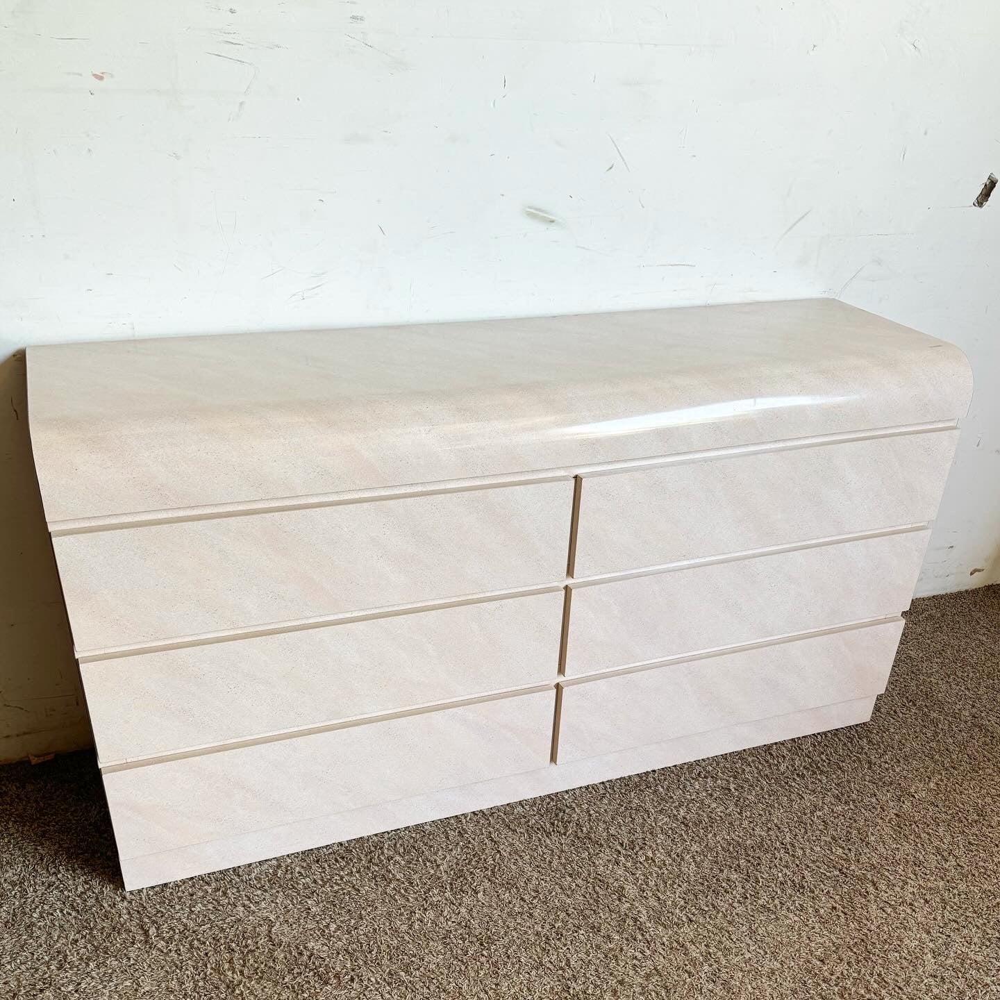 Brighten up your space with this Postmodern Pink and Lavender Airbrush Laminate Waterfall Dresser. Featuring six drawers and a vibrant airbrushed finish, this dresser combines playful sophistication with ample storage. The sleek waterfall design