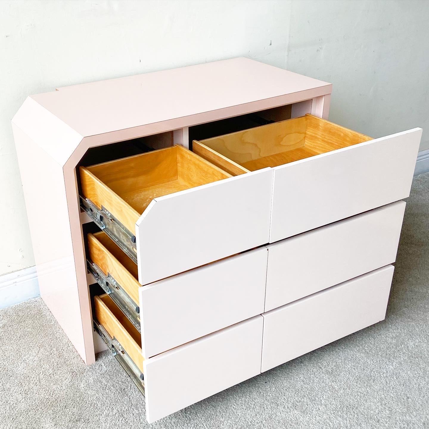 Exceptional 1980s postmodern dresser with 6 drawers. Features a pink and light pink lacquer laminate.

Additional information:
Material: Wood
Color: Pink
Style: Postmodern
Time Period: 1980s
Place of origin: USA
Dimension: 37.5