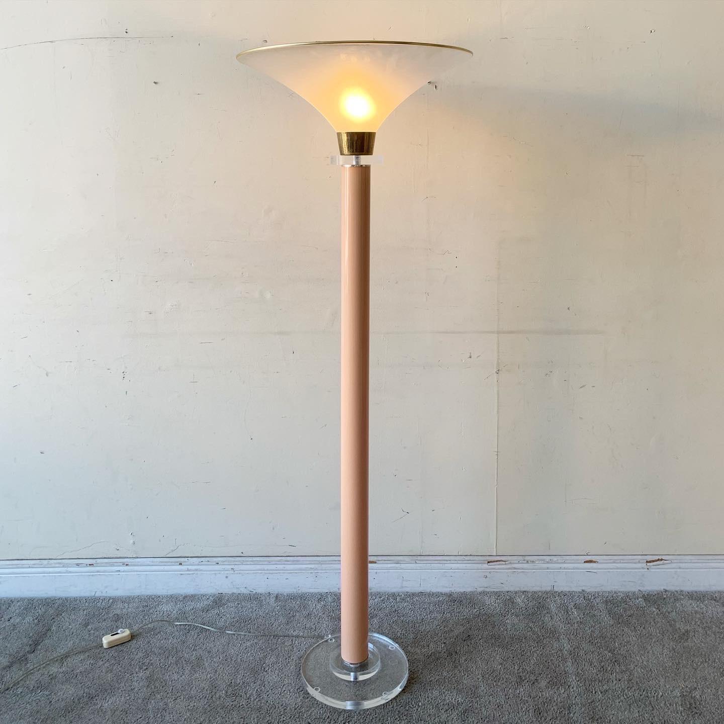 Amazing postmodern Italian dimmable torch lamp. Features a pink body with stacked lucite and gold trimming.
 