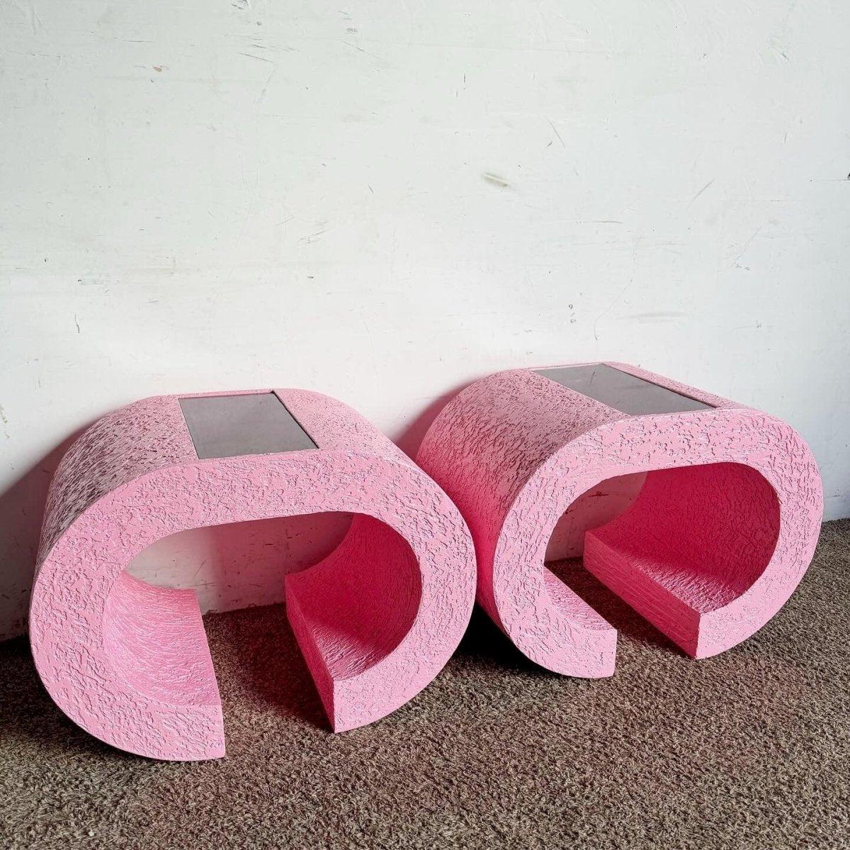 Elevate your decor with the Postmodern Pink Waterfall Side Table, featuring a sleek silhouette and smoked glass top. Inspired by Karl Springer.
 
 We sell items as acquired, without restoring or repairing. Vintage pieces may have age-related wear.