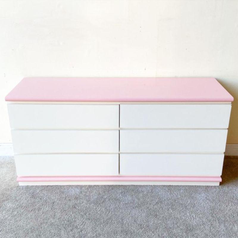 Amazing postmodern Dresser straight out of the 80s. The south Florida relic features 6 spacious drawers and a white and pink lacquer laminate.

Additional information:
Materials: Wood
Color: Pink, White
Style: Postmodern
Time Period: 1980s
Place of