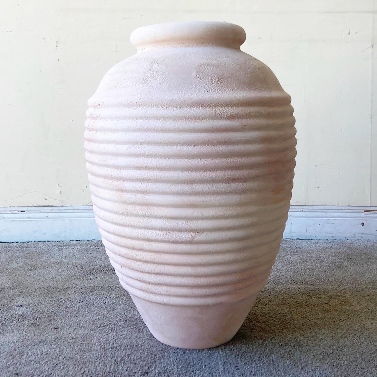 Exceptional postmodern ceramic floor vase. Features a sculpted body with a pink coat.
  