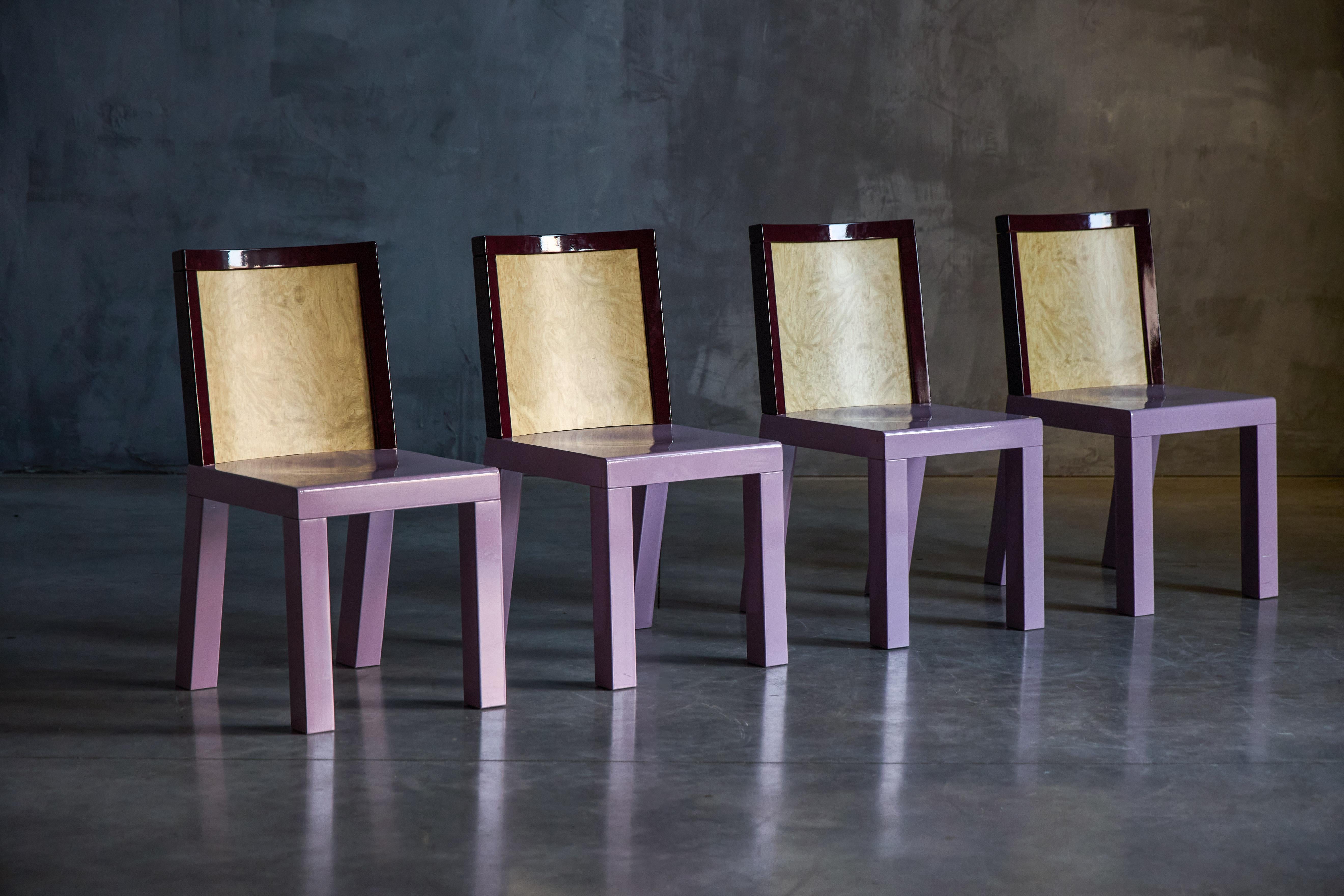Dining chairs featuring expressive burl veneer and a bold combination of pink and burgundy lacquer. With four available, each piece showcases the playful yet sophisticated aesthetic synonymous with Ettore Sottsass (1917–2007), a visionary Italian