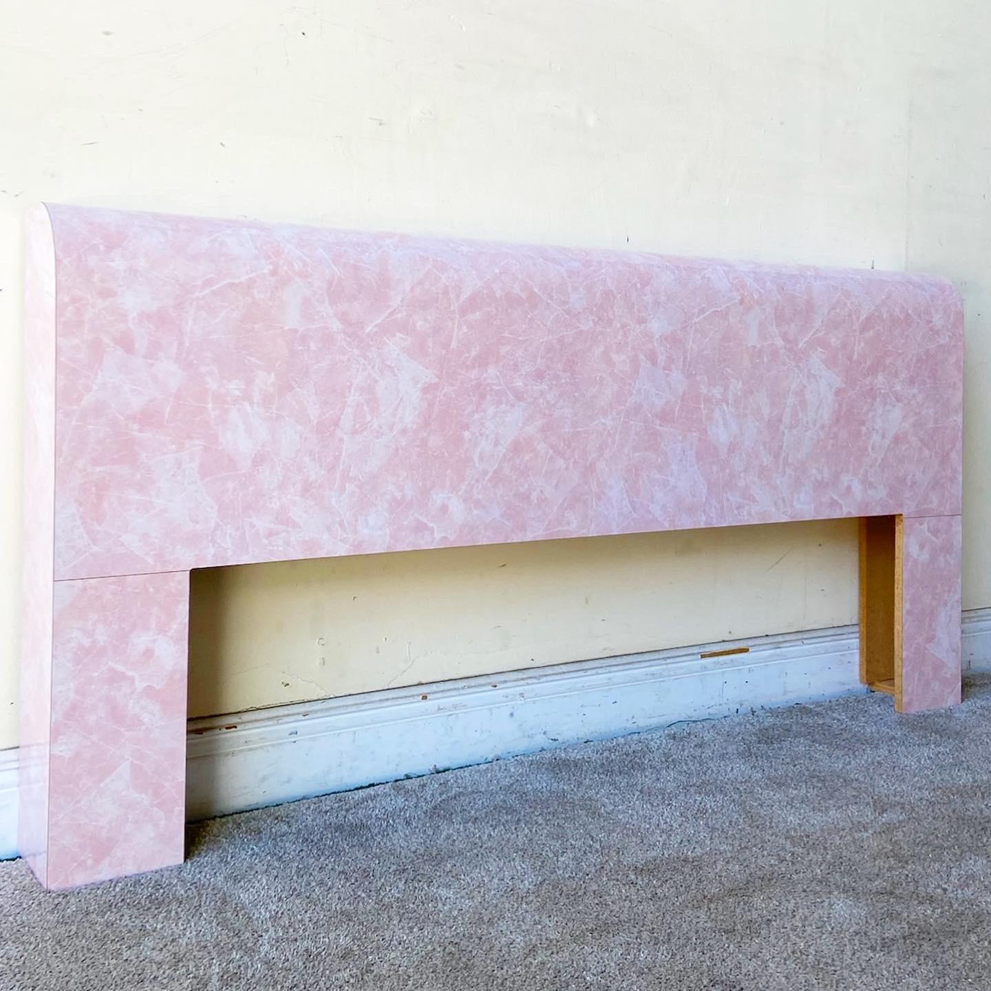 Exceptional postmodern queen size waterfall headboard. Features a pink faux marble glossy laminate.
 
