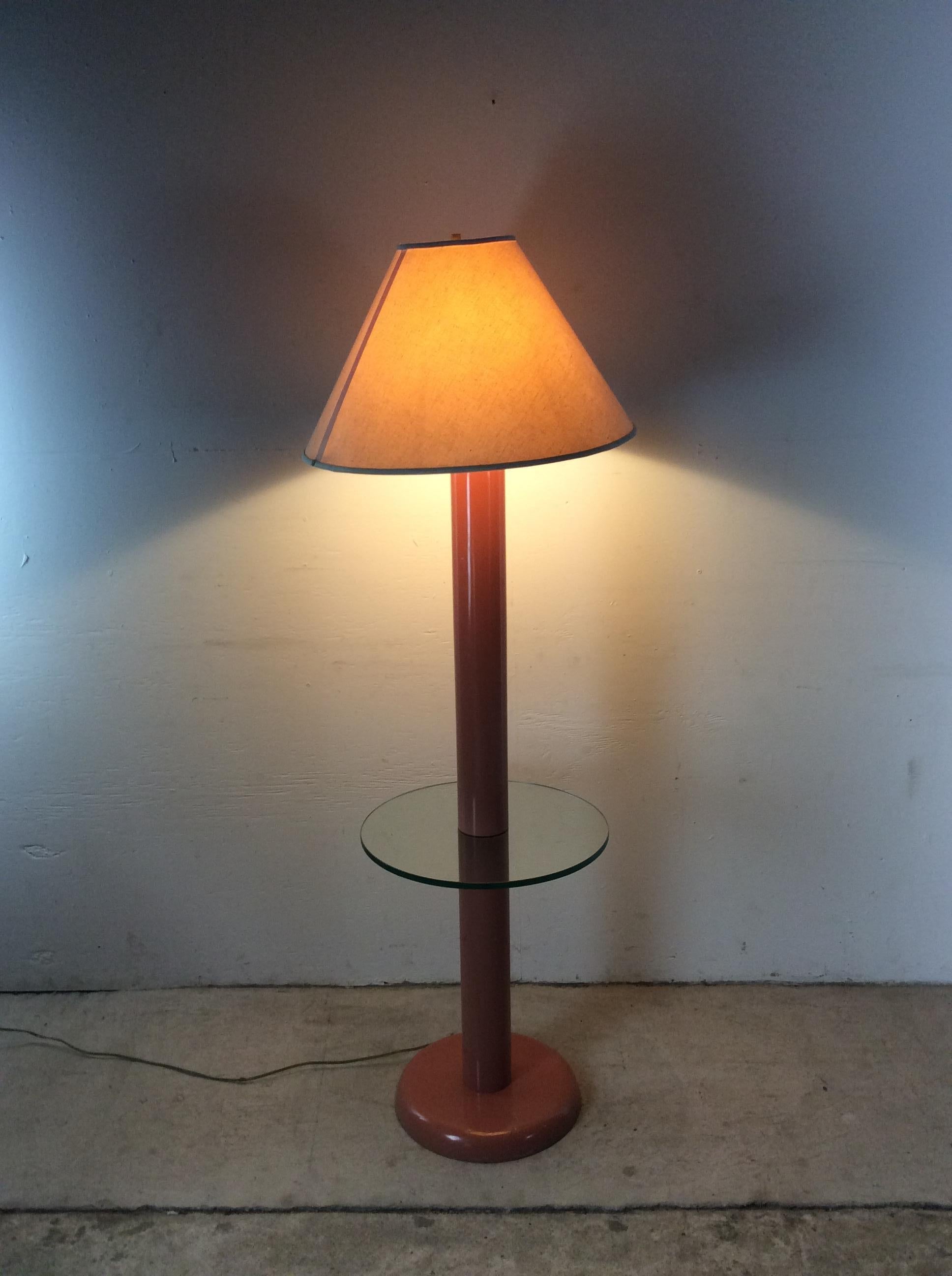 This post modern floor lamp features original pink / salmon paint, built-in round glass table, fully functional original wiring and vintage empire shade.  Glass table measures 18