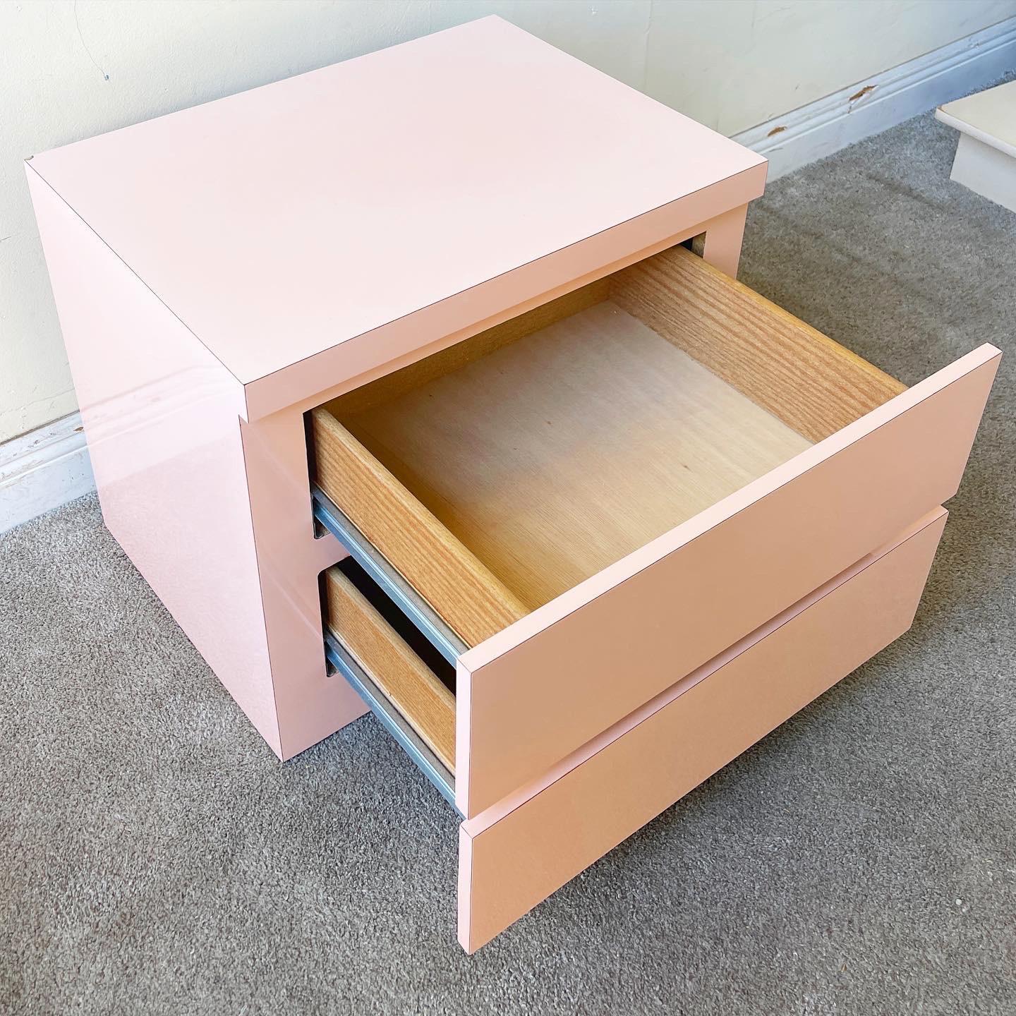 Amazing postmodern nightstand with 2 spacious drawers. Features a pink lacquer laminate.

Additional information:
Material: Wood
Color: Pink
Style: Postmodern
Time Period: 1980s
Place of origin: USA
Dimension: 23