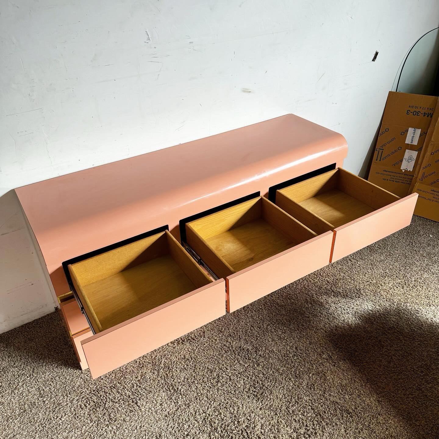 Late 20th Century Postmodern Pink Lacquer Laminate Waterfall Dresser With Gold Accents