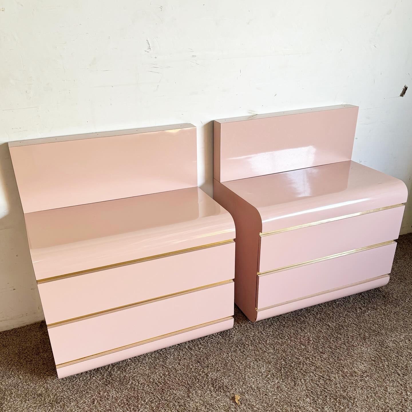 Discover the bold elegance of Postmodern Pink Lacquer Laminate Waterfall Nightstands with Gold Accents. These pieces blend vibrant pink with chic gold, offering stylish storage and a pop of color to your bedroom.