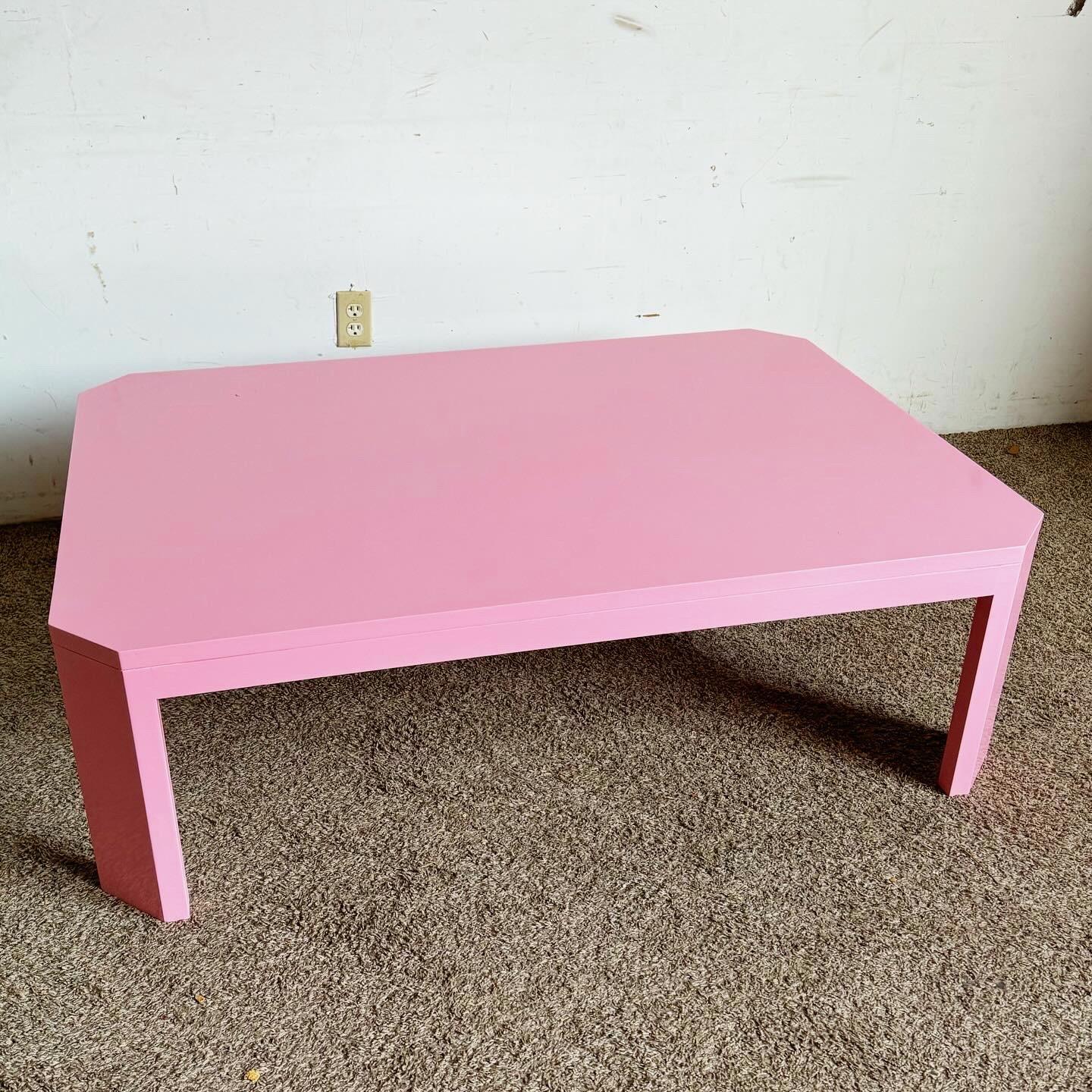 Embrace the vibrant spirit of postmodern design with this Pink Lacquered Coffee Table. Made from durable solid oak, it features a high gloss pink finish for a lively, contemporary look. Perfect as a playful centerpiece, it combines functionality