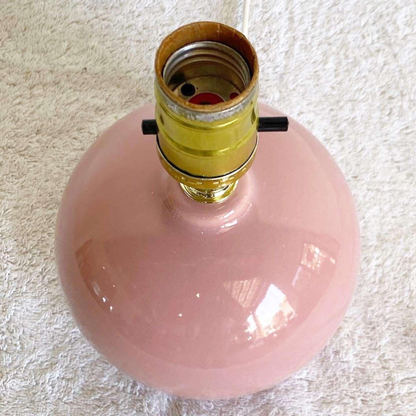 Amazing vintage postmodern spherical miniature table lamp. Features a glossy pink mauve finish.