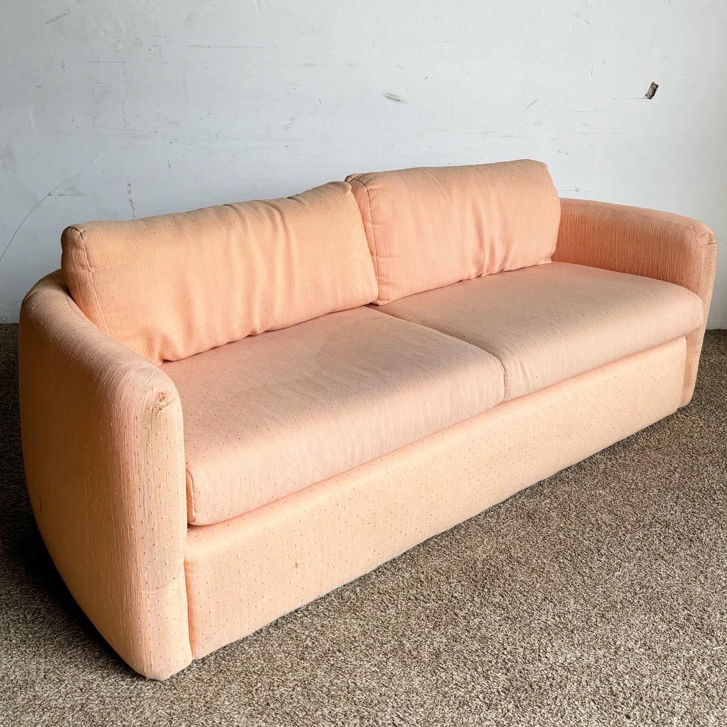 The Postmodern Pink Sofa by Thayer Coggin is a vibrant and stylish addition to any modern interior. With its bold pink upholstery and clean lines, this sofa embodies postmodern charm and comfort, perfect for bringing a lively and contemporary flair