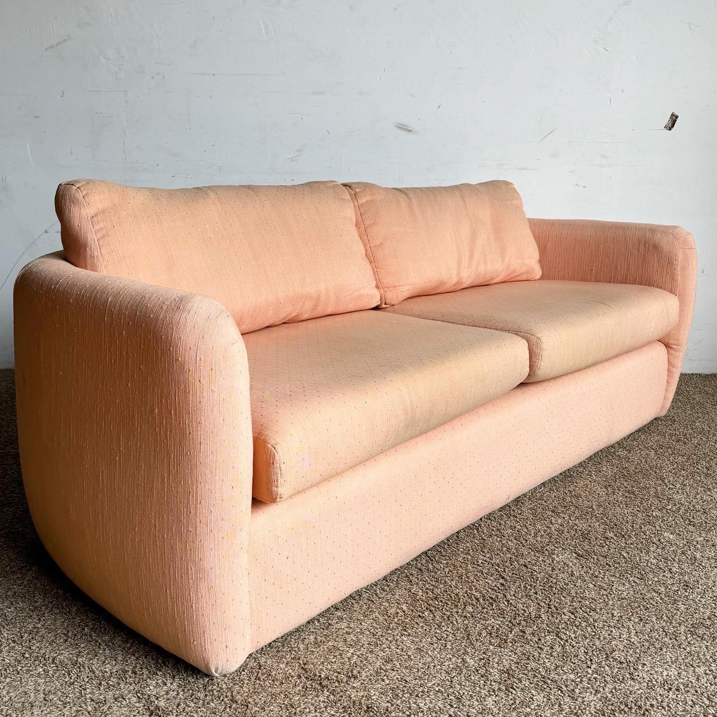 The Postmodern Pink Sofa by Thayer Coggin is a vibrant addition to any contemporary setting. Its bold pink upholstery and minimalist design blend fun with sophistication, perfect for a stylish living space.
Discoloration and wear to the fabric as