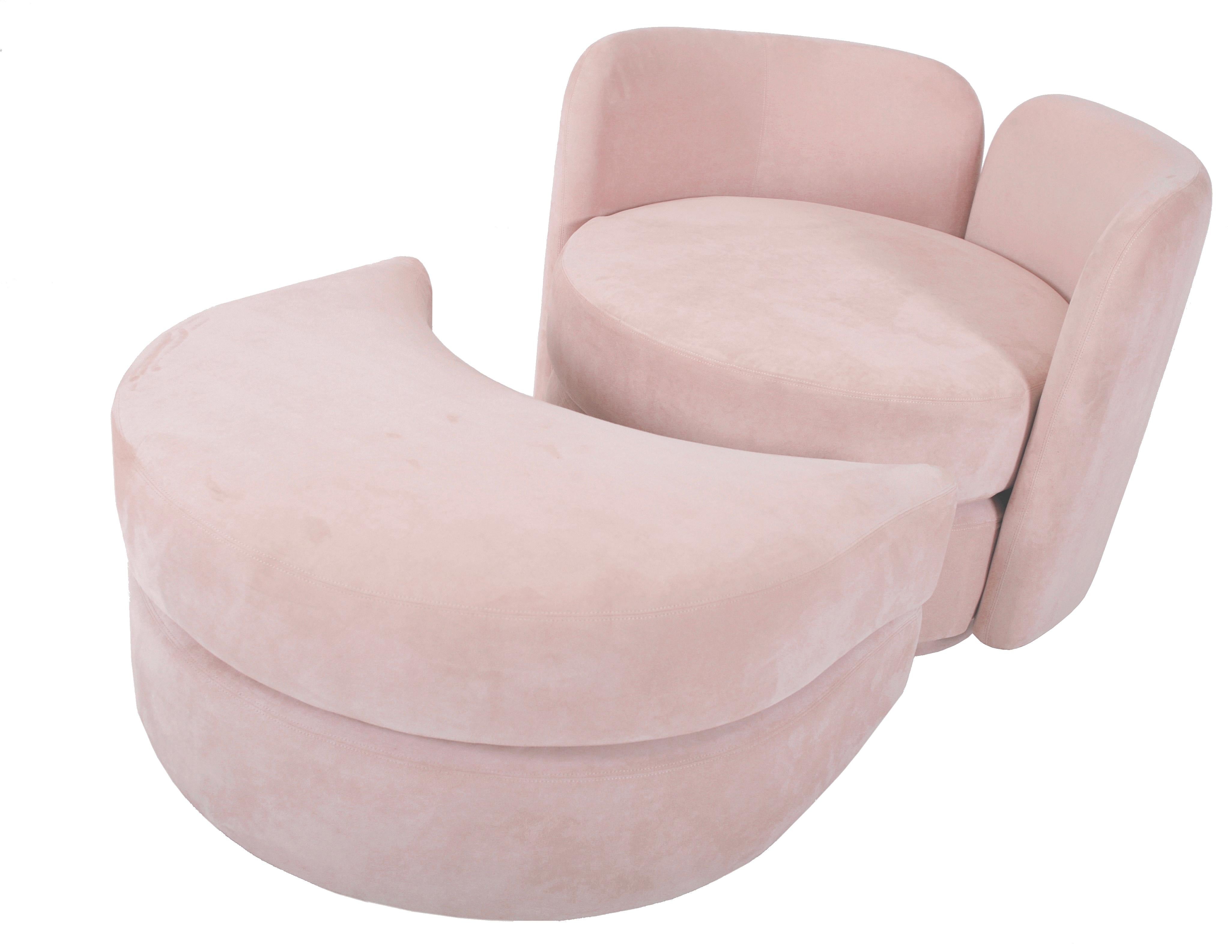 Large scale swivel chair with split back and rolling ottoman. Original pink ultra-suede fabric. Postmodern design attributed to Milo Baughman.