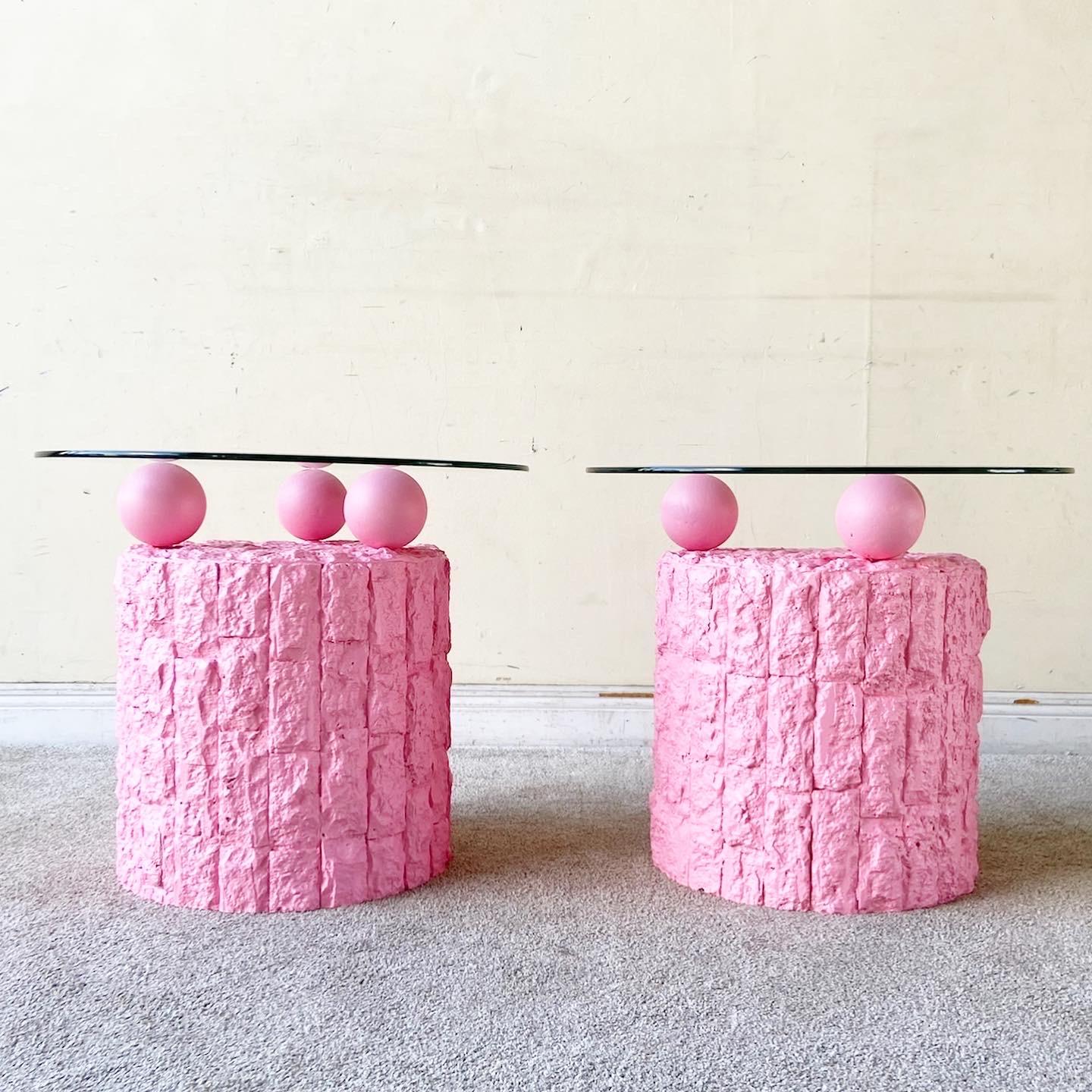 Outstanding pair of postmodern tessellated stone side tables. Each feature a painted hot pink finish with circular beveled glass tops.
