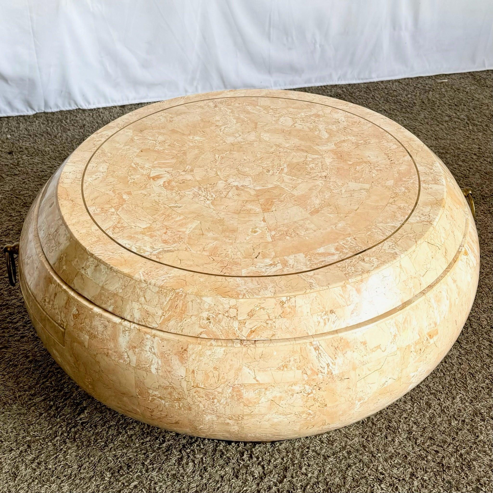 Postmodern pink tessellated stone swivel-top coffee table with brass inlay and extending tier—functional art for your living space.
 
 One crack on the pull out shelf which has no affect on the structural integrity of the item. 
 
 We sell items as