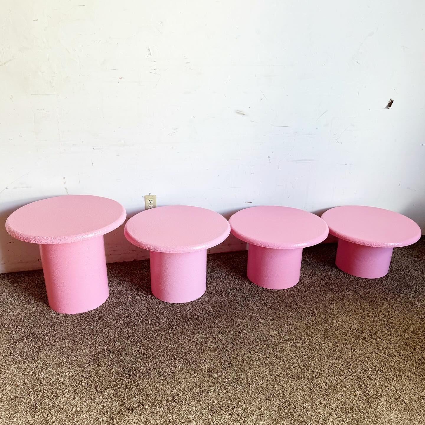 Elevate your home's style with this striking set of four Postmodern Pink Textured Circular Mushroom Nesting Tables. Each table features a unique pink textured finish, adding modern and playful flair to any room. Designed to nest together, these
