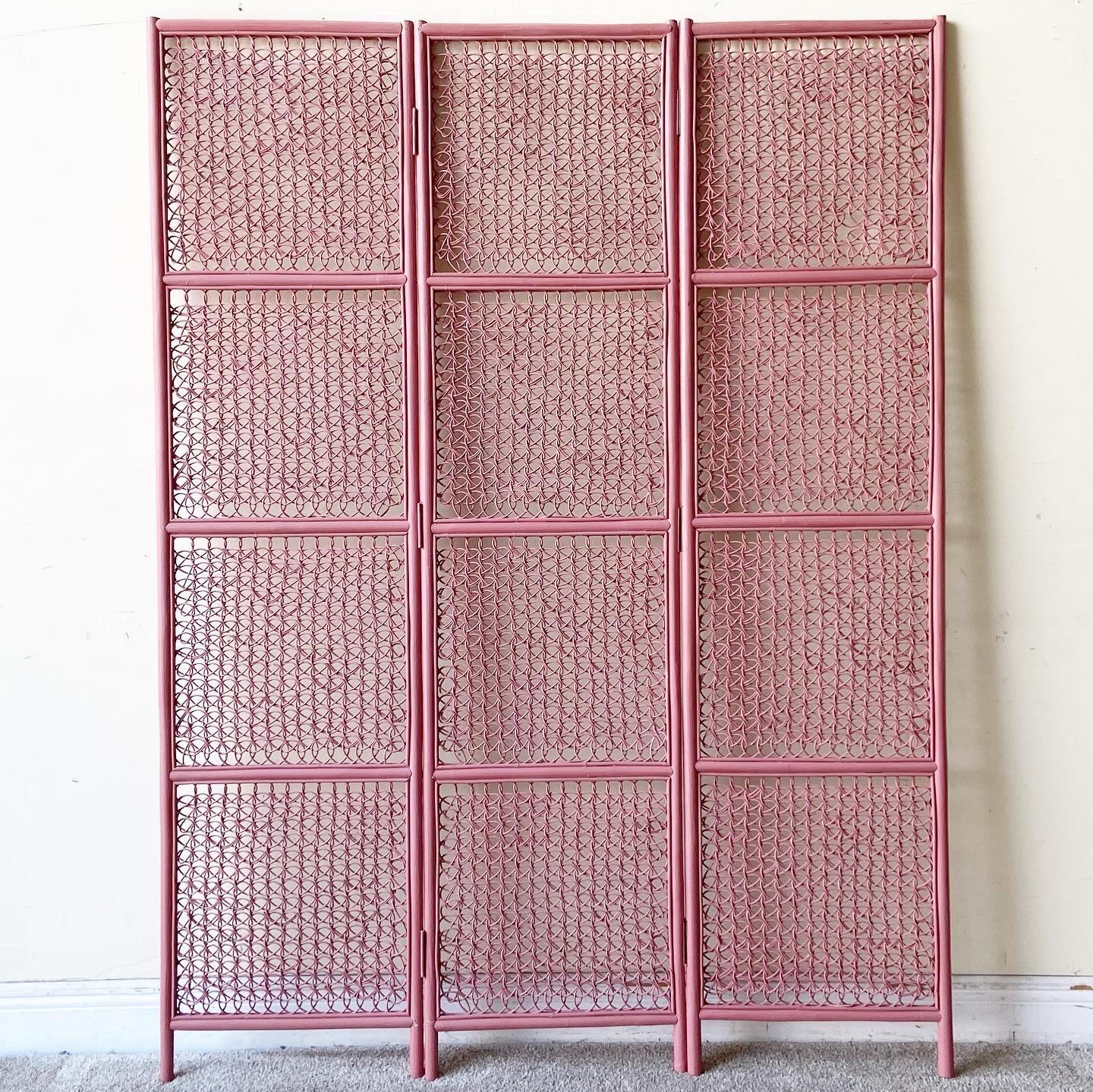 Exceptional woven three panel room divider. Features a painted pink finish.
  