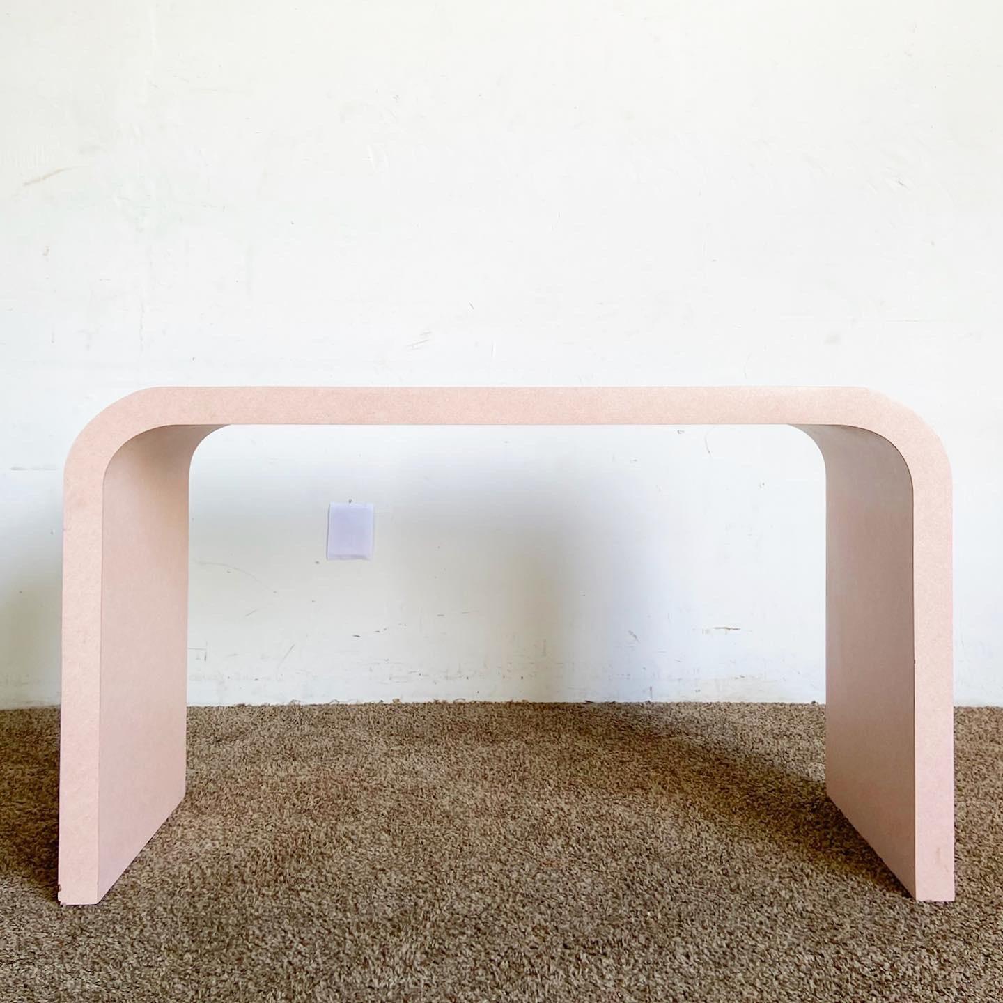 Enrich your space with a pop of color and modern design with our Postmodern Pink Wash Laminate Waterfall Console Table, a perfect blend of functionality and artistic flair.

Standout Postmodern Console Table with a vibrant pink wash finish.
Features