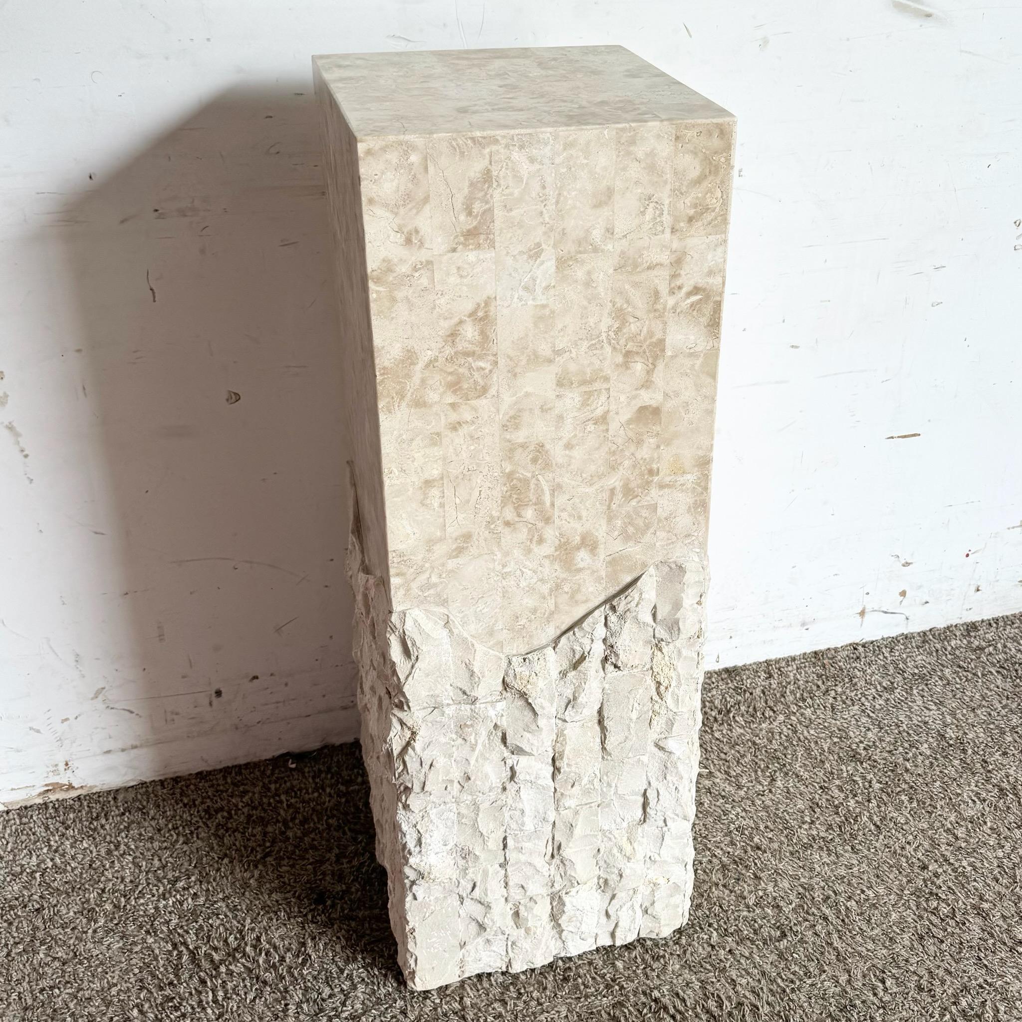 This unique postmodern pedestal combines the elegance of polished tessellated stone with the rugged beauty of raw stone. The rectangular design features a striking contrast between the smooth upper half and the textured lower portion, making it an