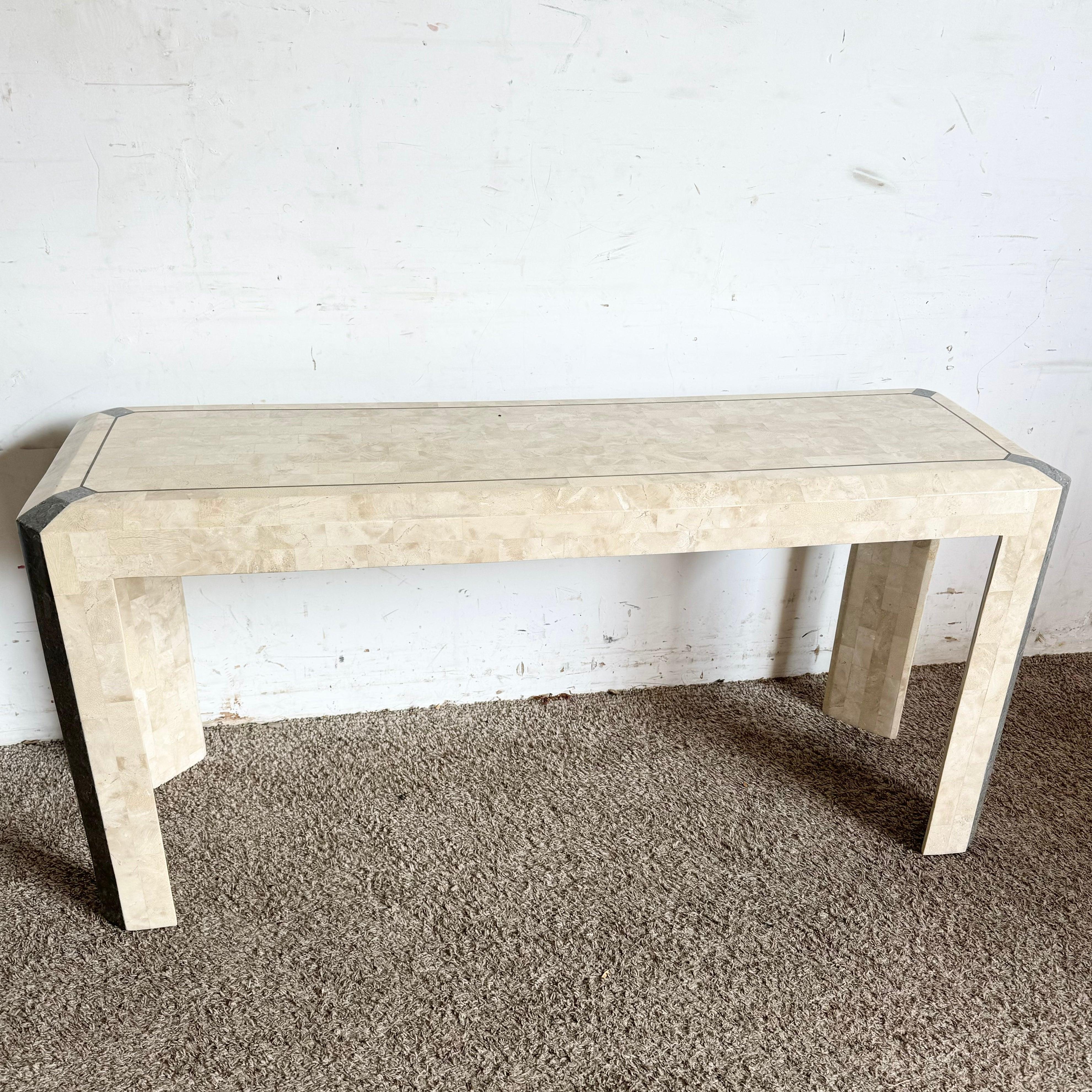 Postmodern Tessellated Stone Shell Console Table with brass inlay, a sophisticated addition to entryways or living spaces with rich texture and style.
 
 One crack in the stone as shown in a corner and chip on another edge as shown in the photos. We