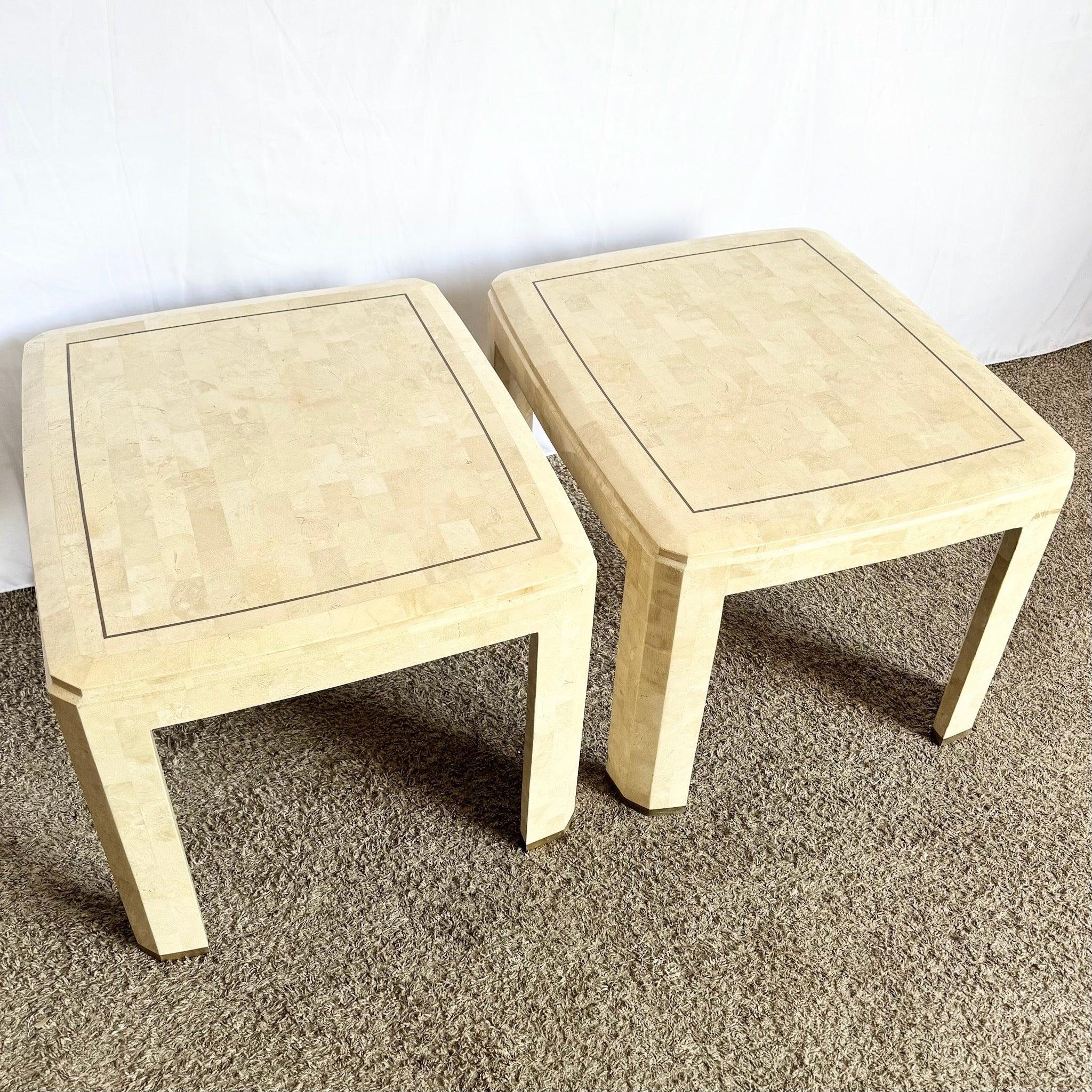 Postmodern Tessellated Stone Side Tables pair with polished stone tops, brass inlay accents, and sculptural pedestal form—1980s elegance and modern flair.
 

 We sell items as acquired, without restoring or repairing. Vintage pieces may have