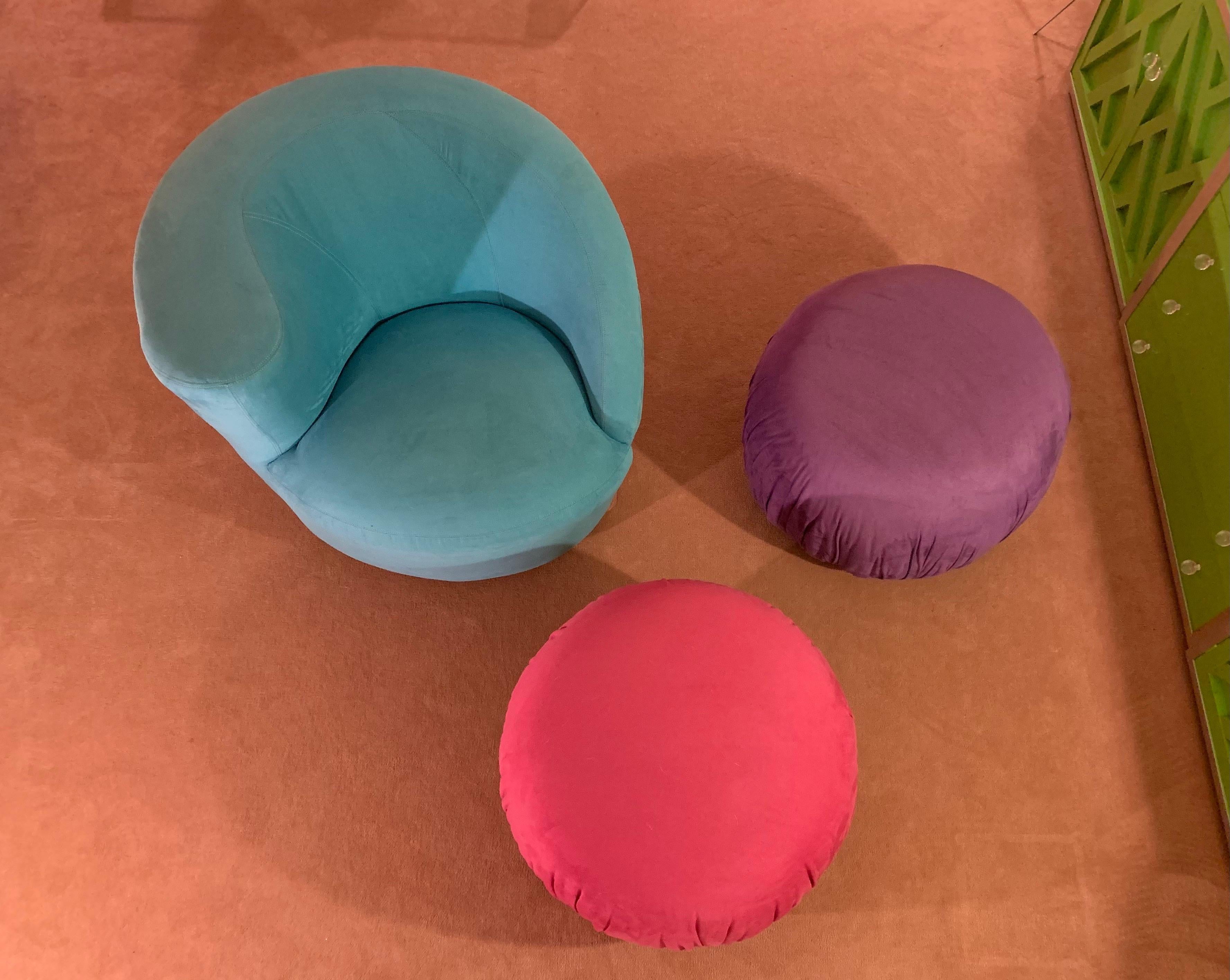 Wonderfully fun round ottomans in bright candy-colored ultra-suede.

Lightweight enough to move easily, making these a clever ancillary seating option

Directional tags on base. 

