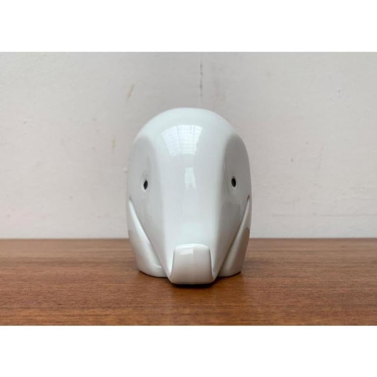 Postmodern Porcelain Elephant Figurine and Penny Bank by Luigi Colani for Höchst, 1980s, in Very Good conditions. Designed 1980 to 1989 This piece has an attribution mark.

Additional information:
Materials: Porcelain
Color: Black
Styles: