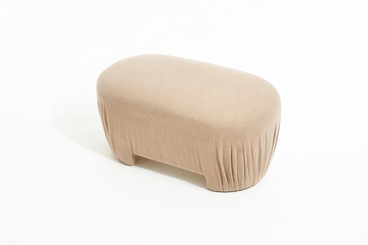 Post Modern pouf bench, 1980. Original camel color material covers this pouf form.