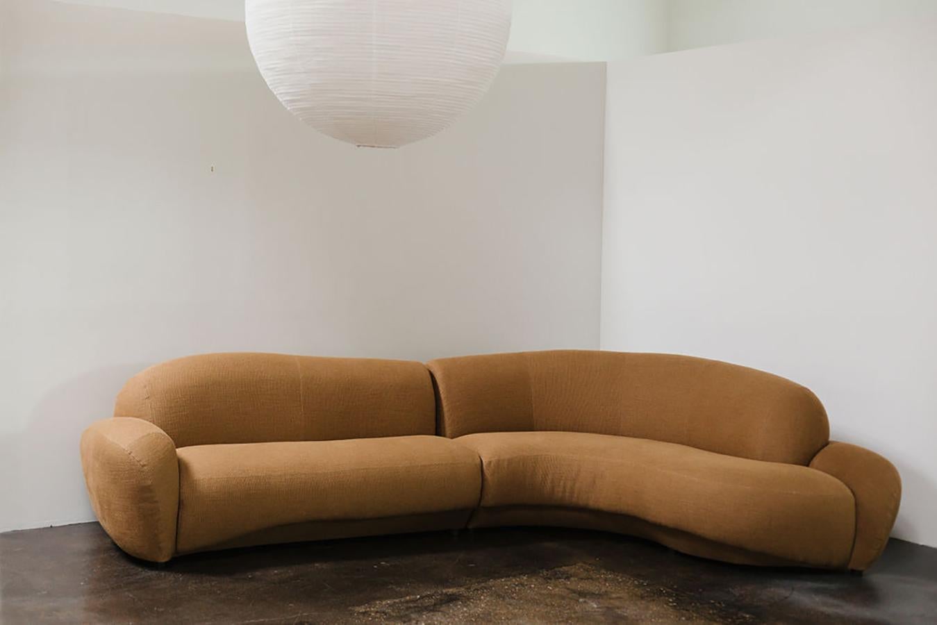 Crafted with meticulous attention to detail, this Postmodern Preview Sectional Sectional showcases an exquisite combination of form and function. Its low-profile design creates an inviting and relaxed seating experience. True to Kagan's design
