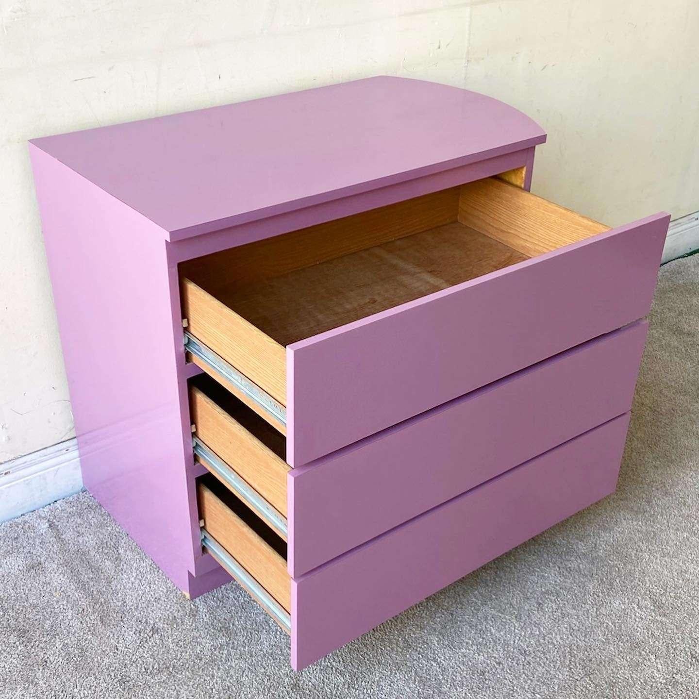 Incredible vintage Postmodern chest of drawers. Features a purple lacquer laminate with three large spacious drawers.