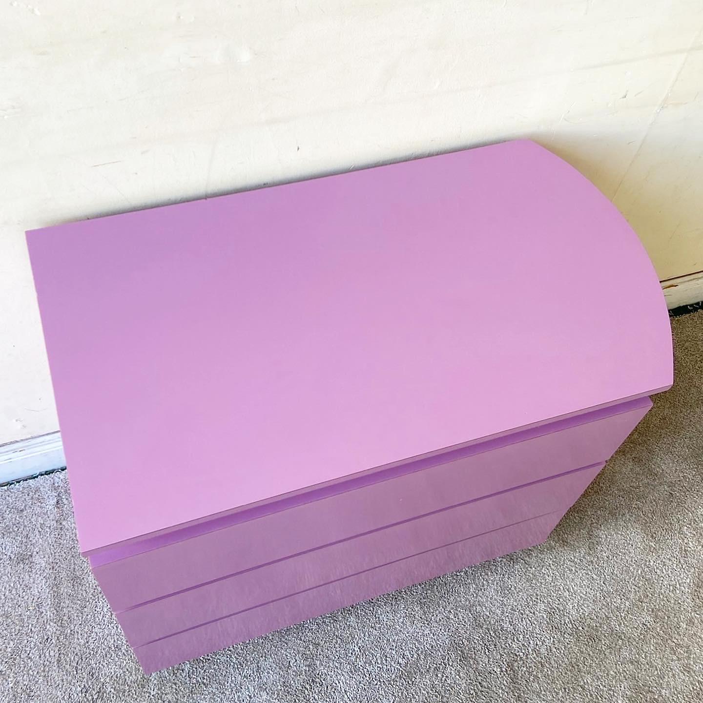 Incredible vintage Postmodern chest of drawers. Features a purple lacquer laminate with three large spacious drawers.
