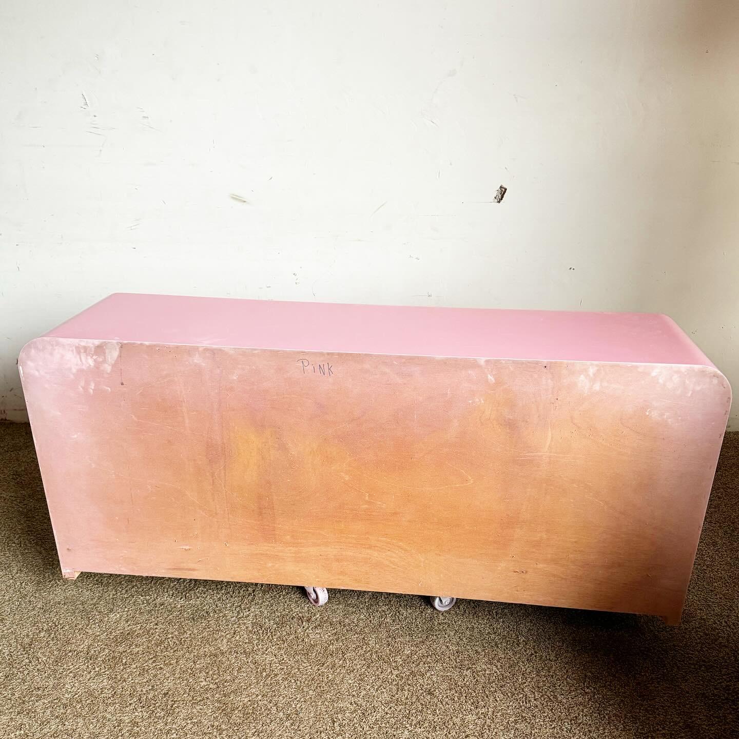Revitalize your space with this Postmodern Purple Pink and Mauve Lacquer Laminate Credenza. This piece dazzles with its vibrant color scheme and unique zigzag stripe, embodying the playful essence of postmodern design. Its distinctive shape and bold