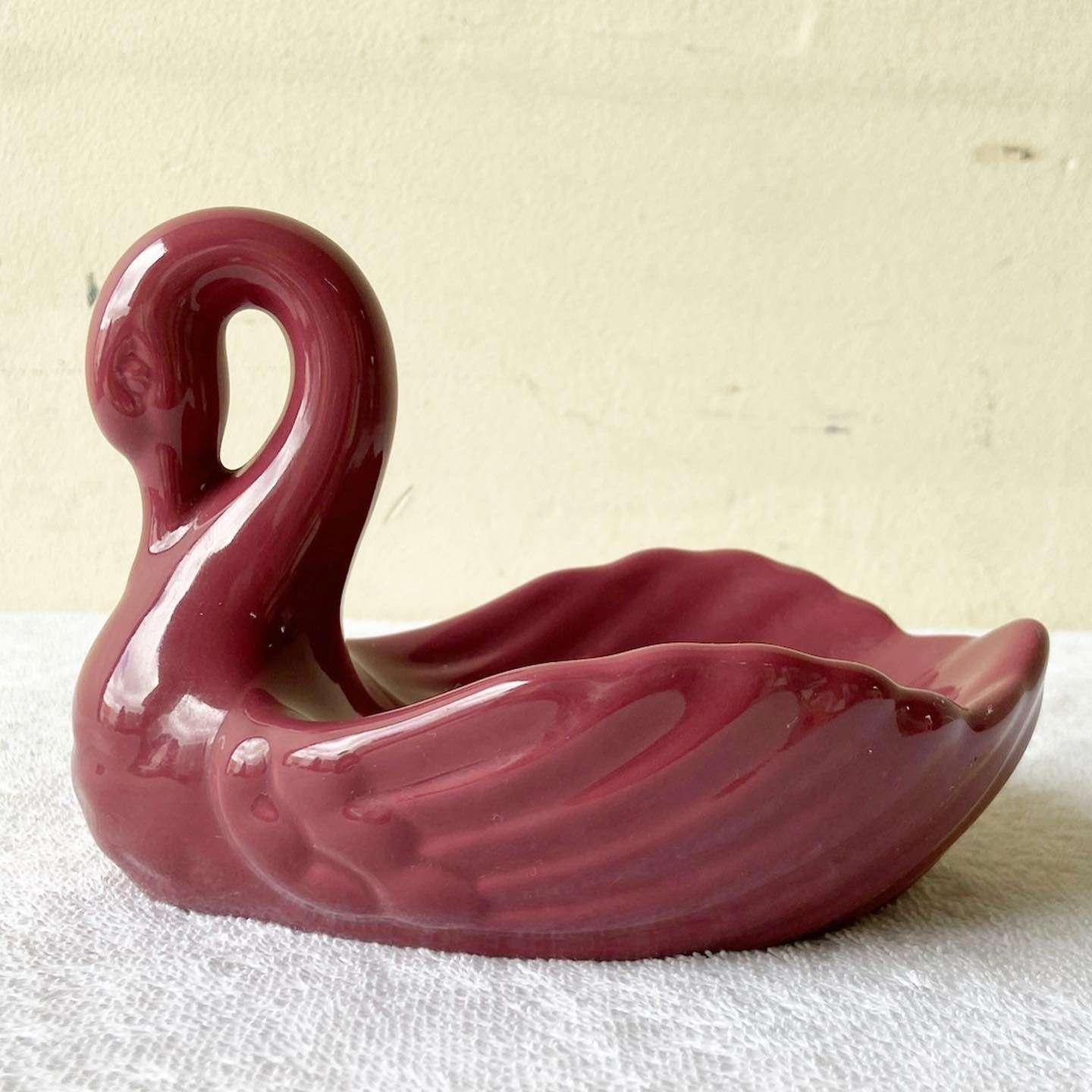 Amazing vintage postmodern swan sofa dish. Features a glossy pink finish.
