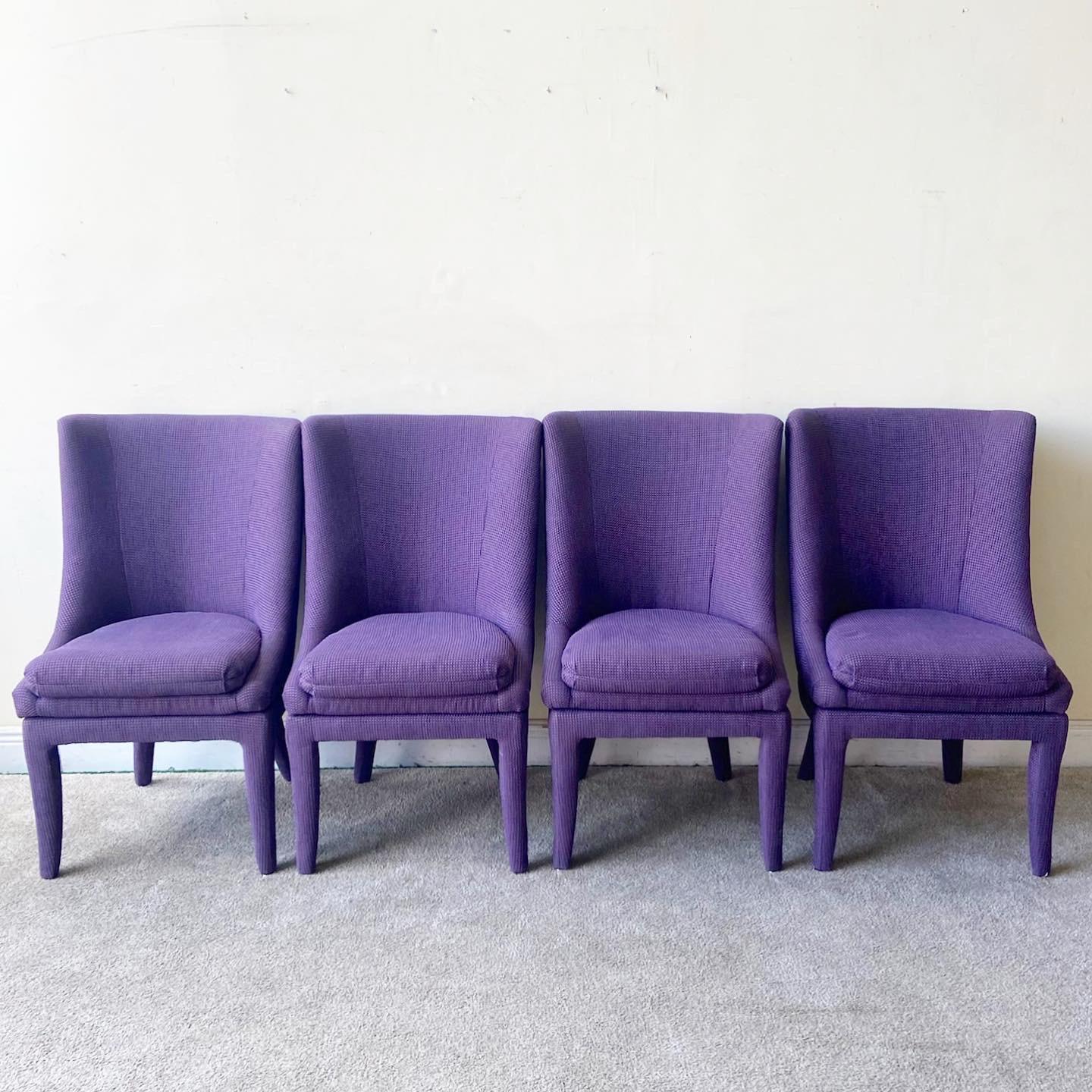 Amazing set of 4 postmodern dining chairs by Carson’s. Each feature a swivel top with a purple fabric.
 