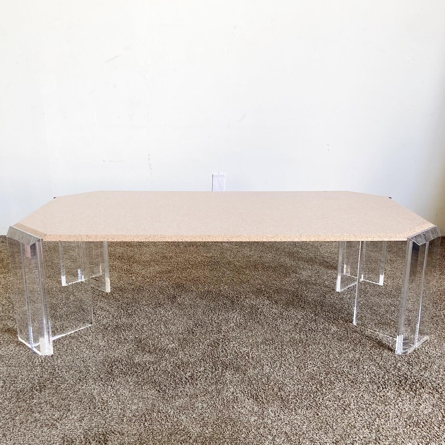 Embrace the elegance of postmodern design with our Rectangular Inlaid Granite Top Lucite Coffee Table. This stunning piece pairs a luxurious inlaid granite top with a sleek, transparent Lucite base, effortlessly merging luxury and modernity. The